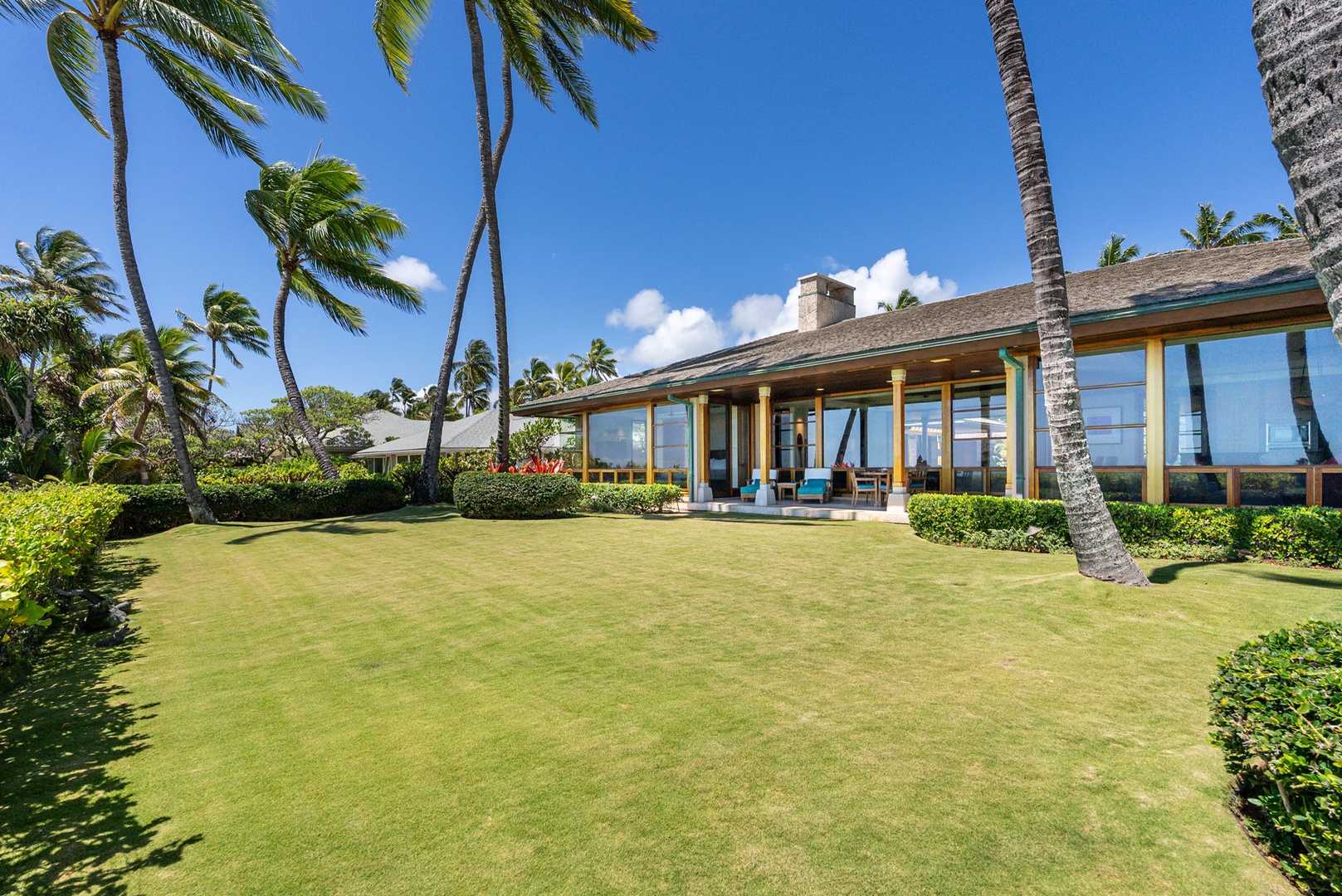 Kailua Vacation Rentals, Kailua Sands - Oceanfront lawn with view toward the home.