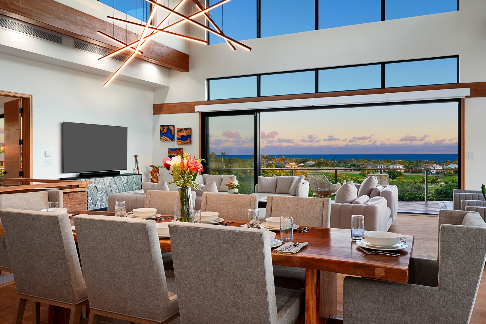 Koloa Vacation Rentals, Hale Keaka at Kukui'ula - Dine in sophistication in an open dining area, offering a panoramic sunset view that complements the elegant interior.