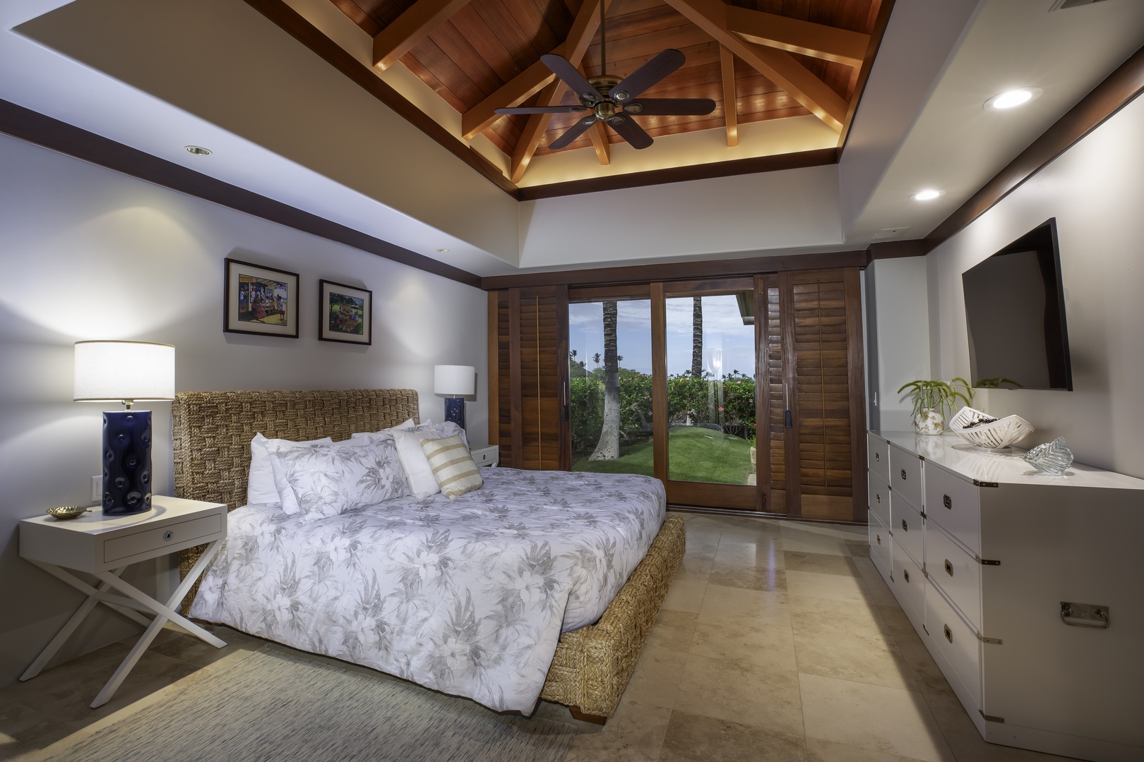 Kamuela Vacation Rentals, Champion Ridge 7 - Your tropical sanctuary features exposed beam ceilings, coastal-inspired decor, and sliding doors opening to lush gardens with palm trees.