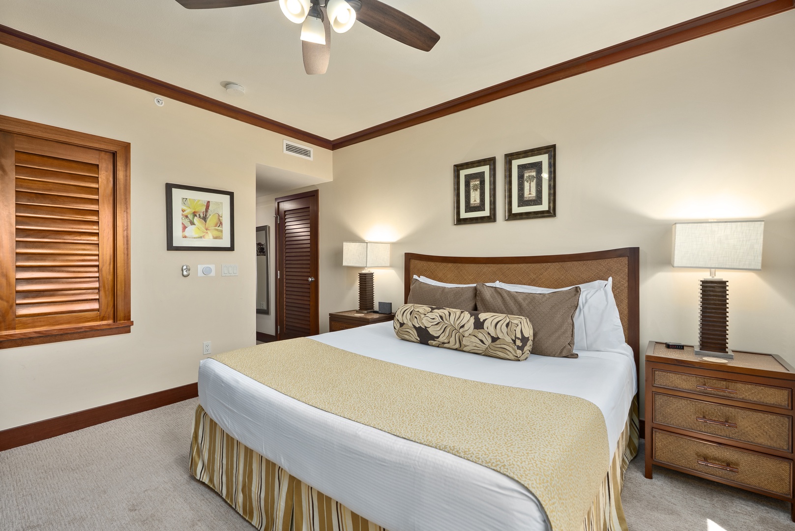 Kapolei Vacation Rentals, Ko Olina Beach Villas O1404 - Draw the plantation shutters in the primary suite for a slow, dim morning in the king bed.