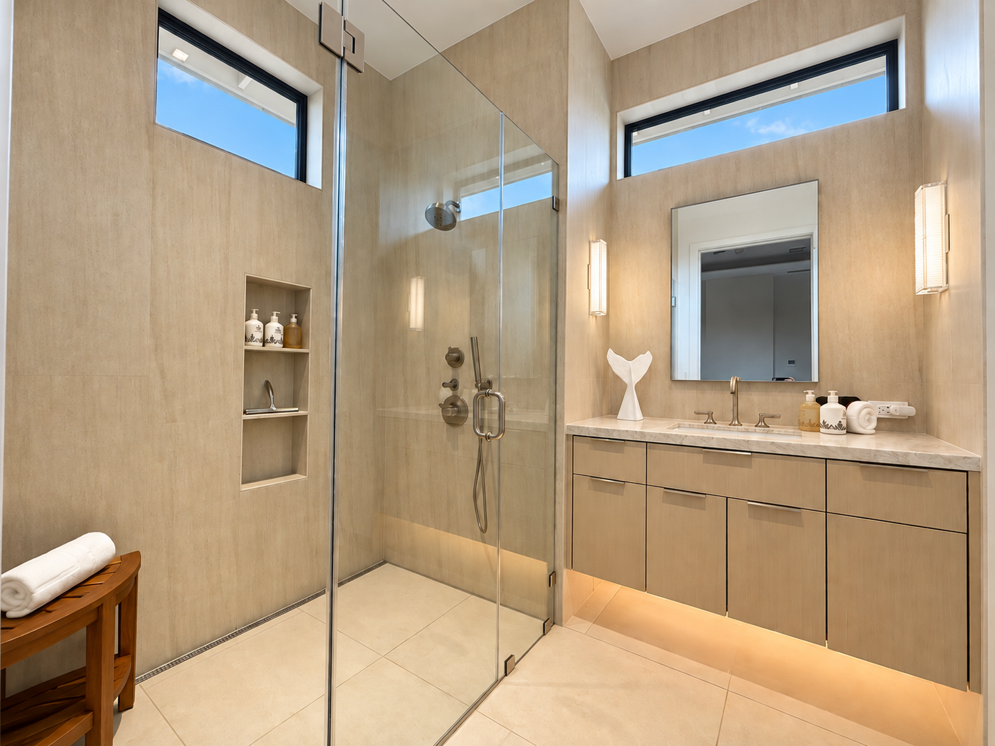 Kamuela Vacation Rentals, 6BD Mauna Lani Lux Golf Estate (5) at One Ocean - An elegant, light-filled ensuite with a glass walk-in shower and a sleek floating vanity
