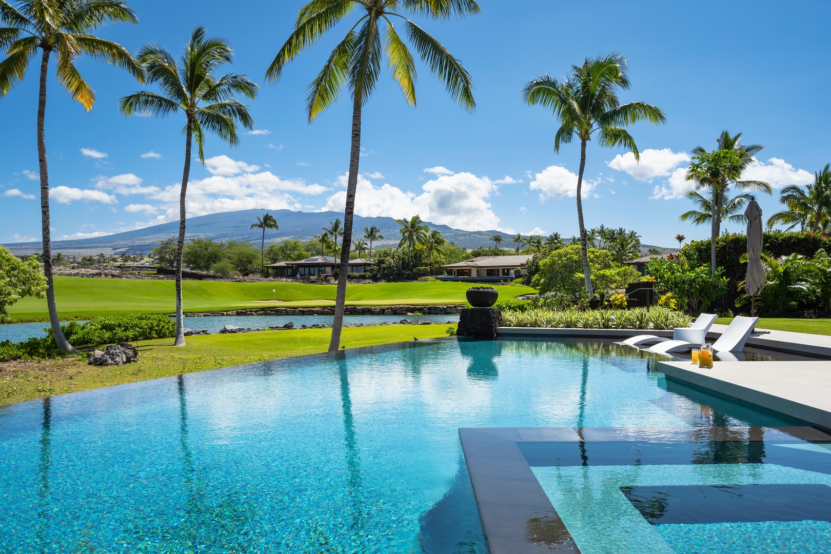Kailua-Kona Vacation Rentals, 4BD Ka'Ulu Estate (102A) at Hualalai Resort - Luxurious infinity pool with swaying palms and mountain views creating the perfect Hawaiian paradise backdrop.