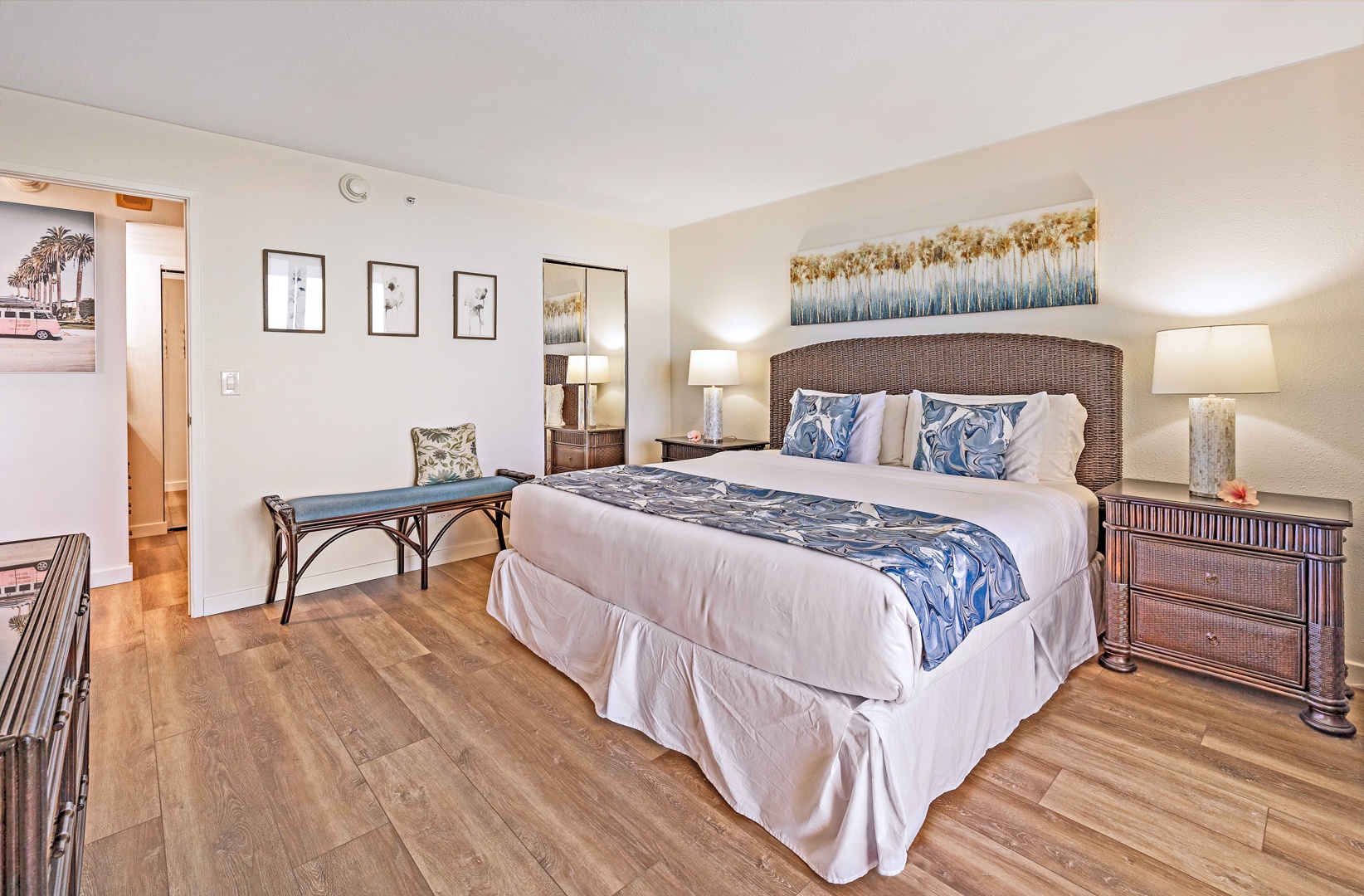 Lahaina Vacation Rentals, Mahana 718 - The bedroom offers a spacious king-sized bed, accentuated by coastal-themed decor and a cozy seating bench.