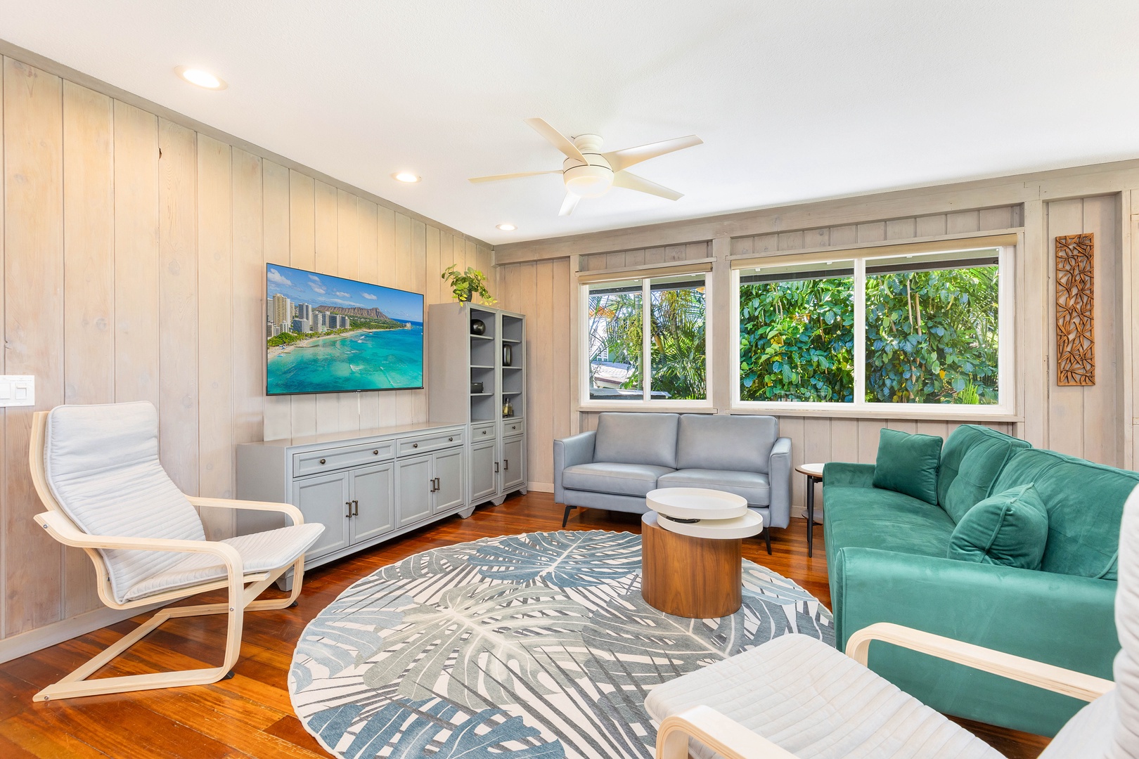 Haleiwa Vacation Rentals, Velzey Villa (3B Vacation Home) - Cozy corner of the living space with natural light and Smart TV, offering both comfort and entertainment.