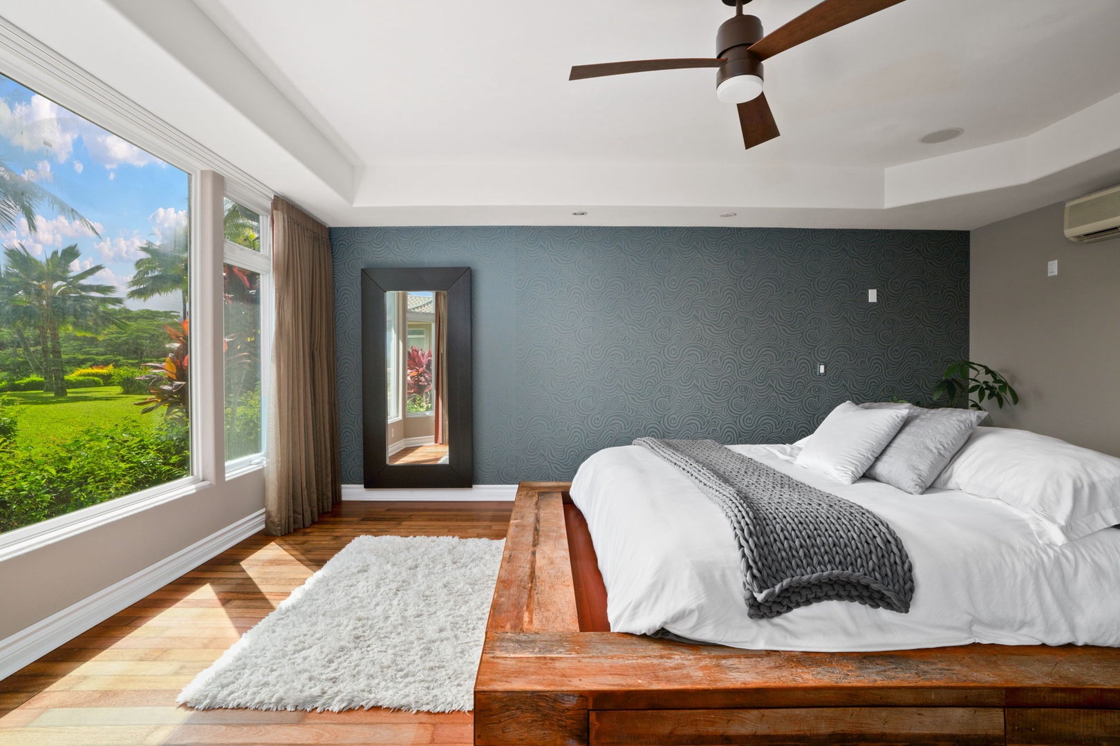 Princeville Vacation Rentals, Kaiulani #8 - Lie back in the primary suite with garden green filling the side windows.