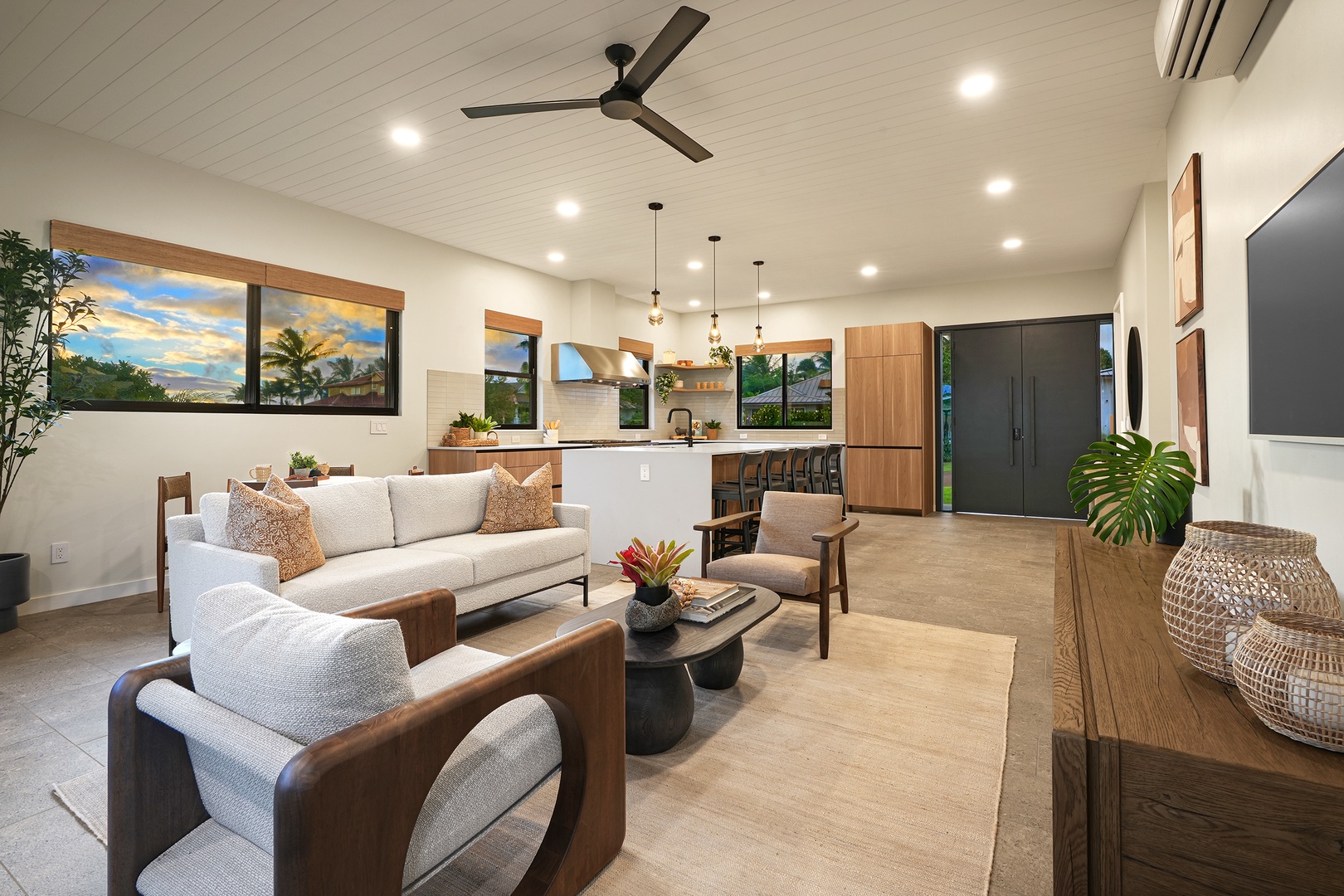 Koloa Vacation Rentals, Ka Hui Ana at Kukuiula - Modern and inviting living room with ample seating and warm, natural accents.