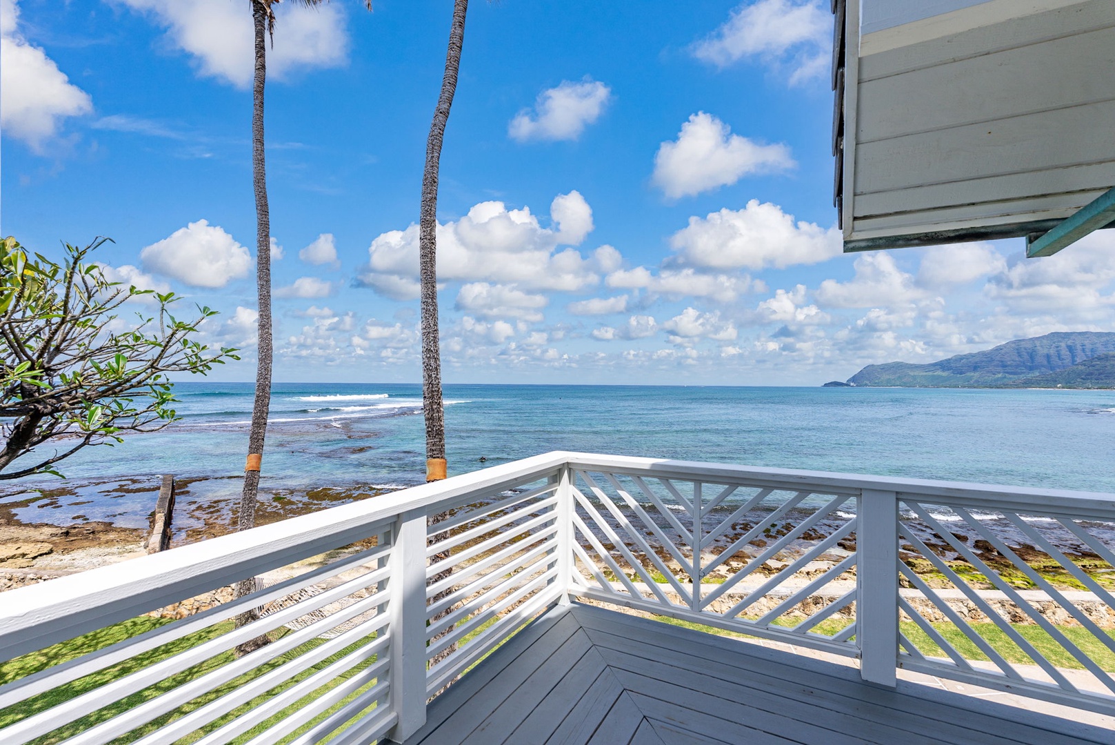 Waianae Vacation Rentals, Ma'ili Blue - Enjoy oceanfront lanai access from your primary bedroom where swaying palms and endless blue skies await.