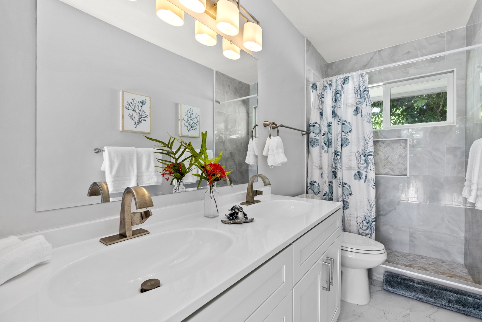 Kailua Vacation Rentals, Hale Aloha - Communal bathroom with dual sink and a walk-in shower