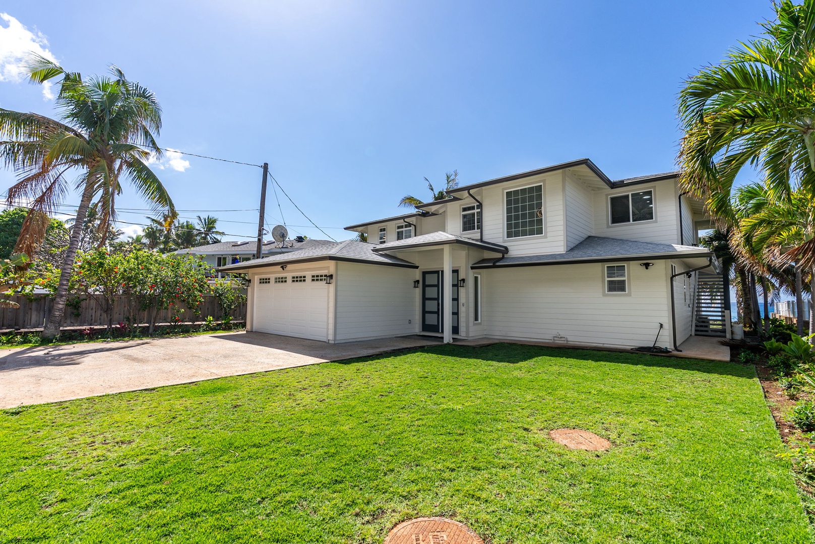 Waianae Vacation Rentals, Oceanfront Luxury Dream Estate - The large front lawn offers additional space for kids to play or pets to roam within the fenced property.