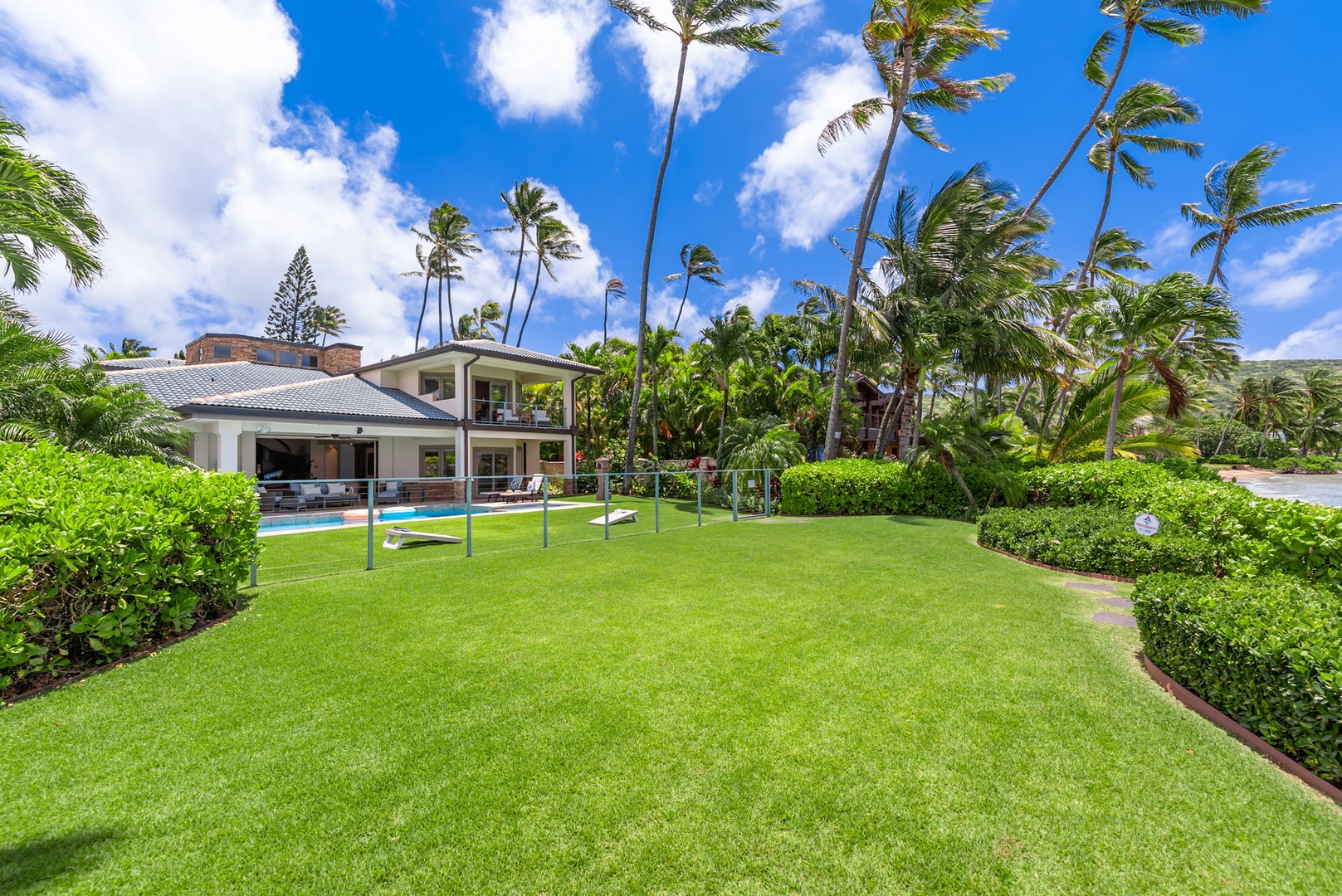 Honolulu Vacation Rentals, Maunalua Estate - Tropical landscaping and bright open grounds surround this spacious coastal estate.