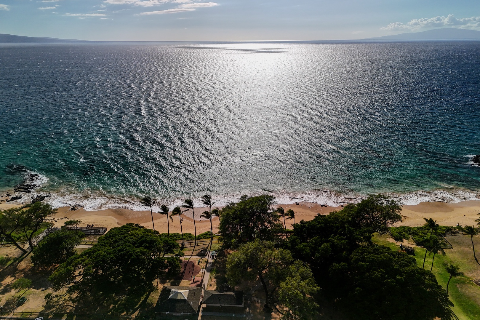 Kihei Vacation Rentals, Haleakala Shores A206 - Afternoon sun turns the bay to hammered silver, the same stretch of sand just a short walk from the building.