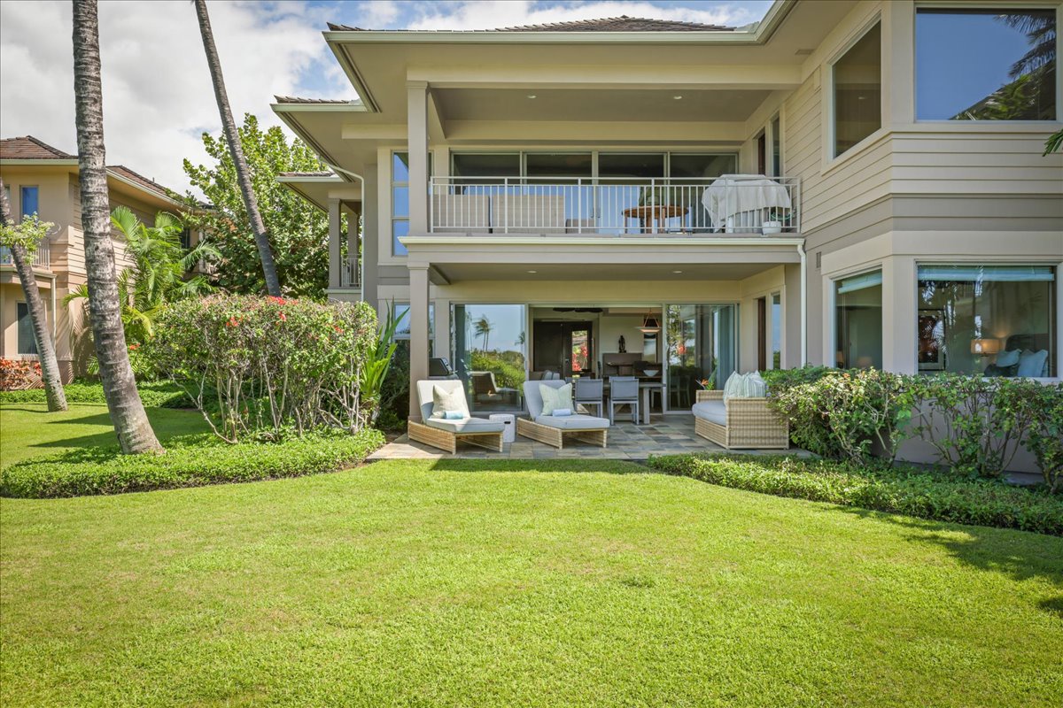 Kailua Kona Vacation Rentals, 2BD Fairways Villa (120C) at Four Seasons Resort at Hualalai - Reverse view featuring ample grassy yard, ideal for children’s play and sunrise/sunset walks.