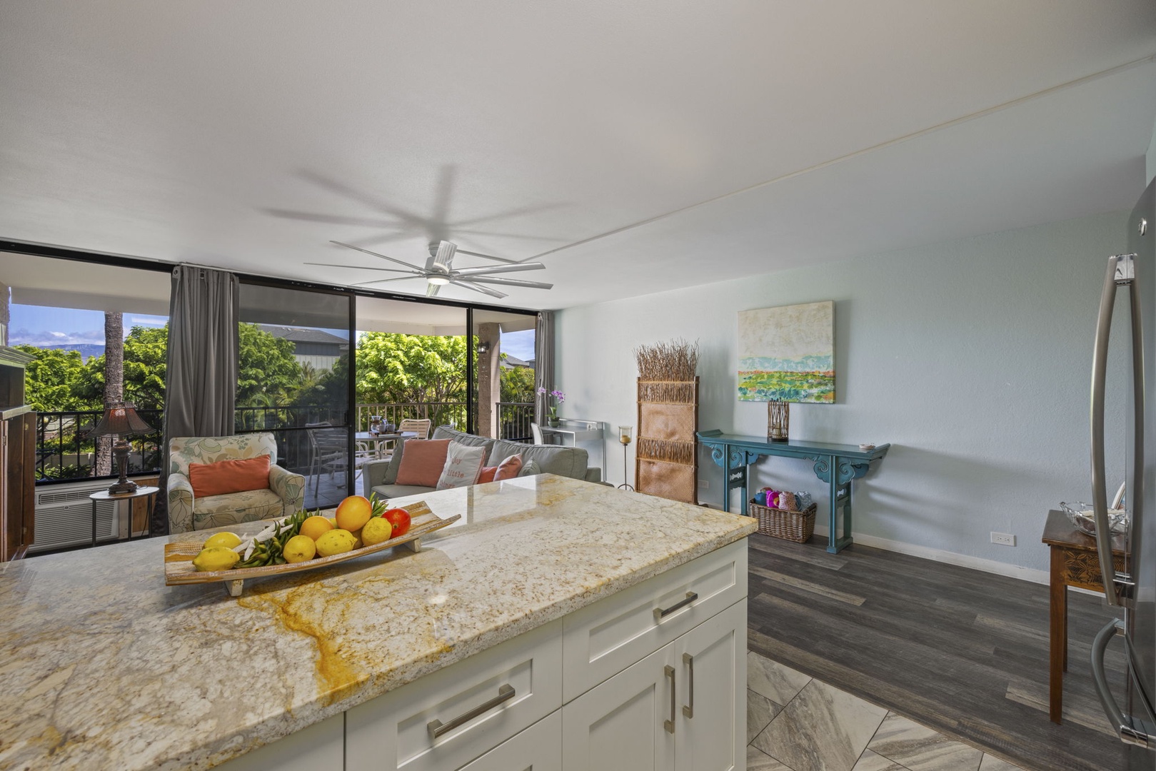 Kihei Vacation Rentals, Kihei Alii Kai C206 - From the island you can see clear across the living room to the treetops outside.