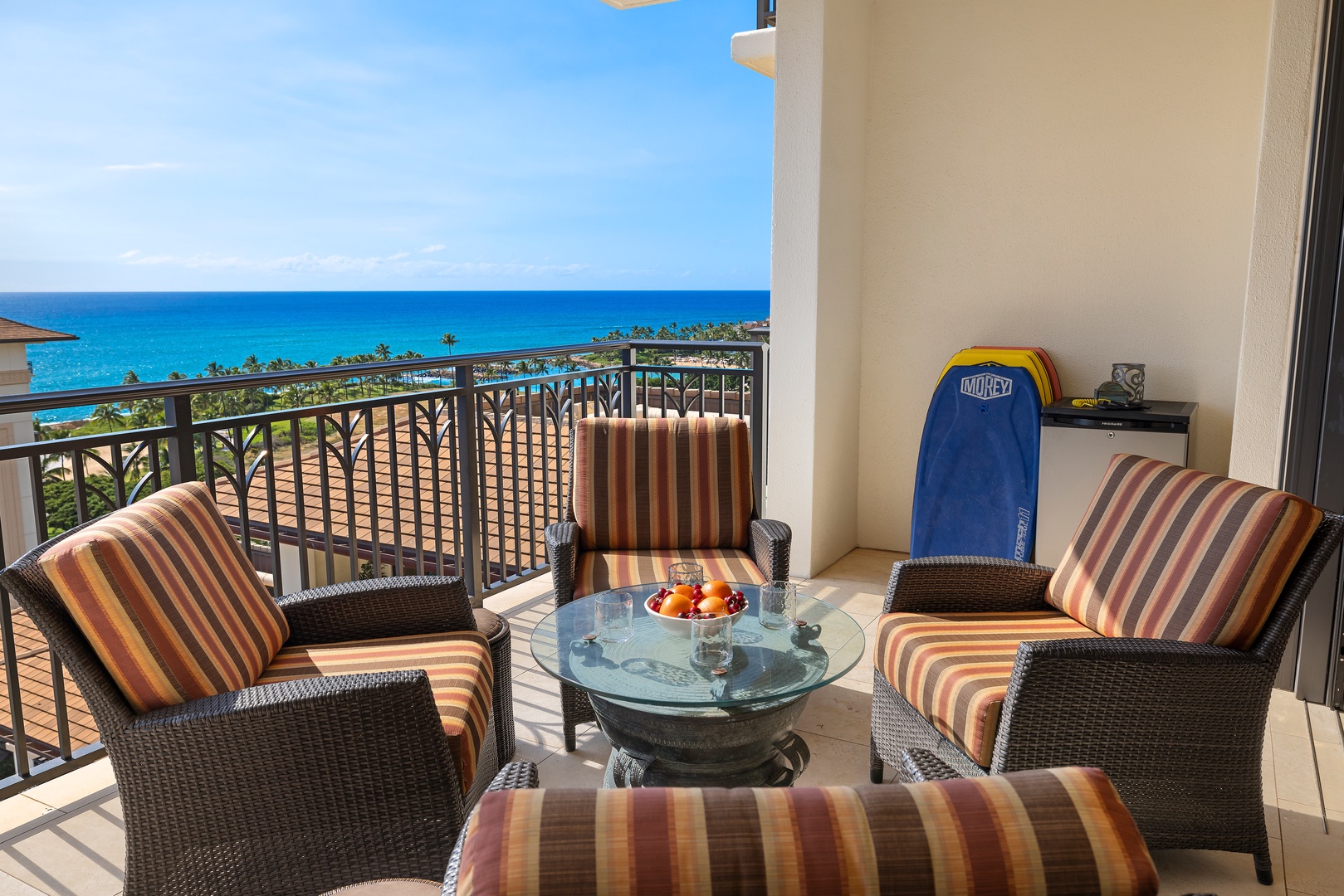 Kapolei Vacation Rentals, Ko Olina Beach Villas O1402 - A balcony set against a stunning ocean view, ready for relaxation or a meal.