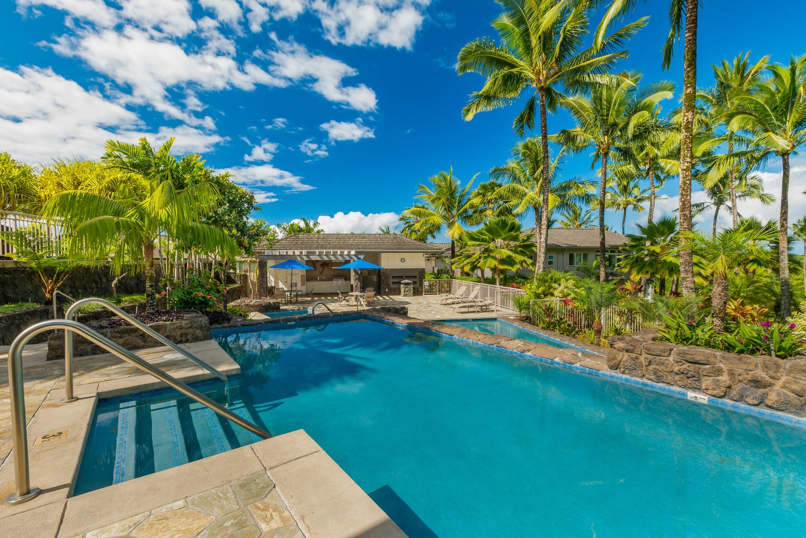 Princeville Vacation Rentals, Kaiulani #8 - Wade down the wide steps into a pool ringed by palms.