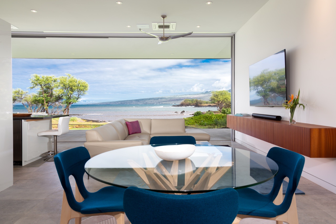 Kamuela Vacation Rentals, Puako’s Ocean Edge Modern Estate - Relax in this cozy lounge area with an ocean-view, ideal for breakfast or games.
