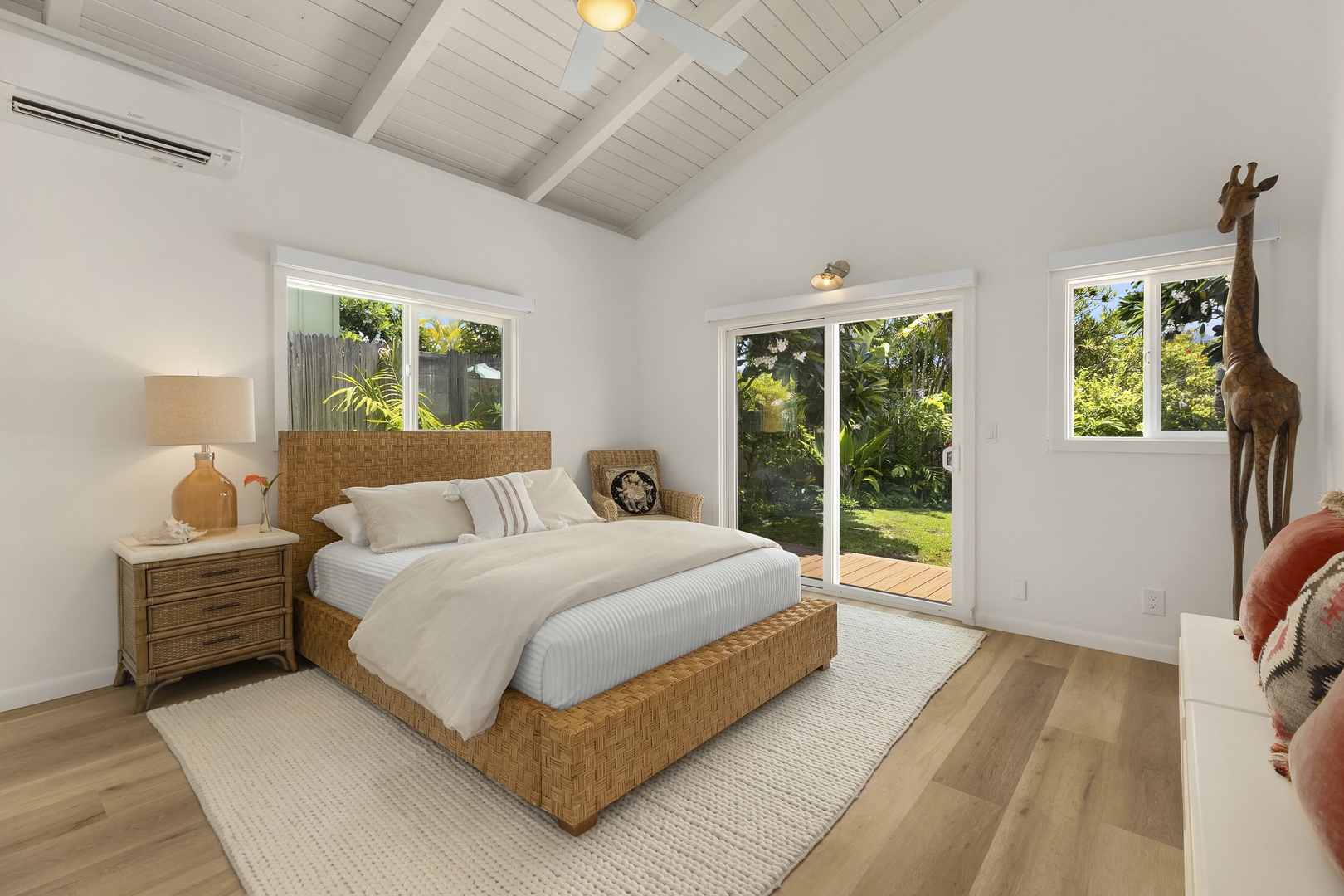 Kailua Vacation Rentals, Ranch Beach House - Primary bedroom with private access  to main lanai and garden area, Split A/C, and access too Outdoor Shower.