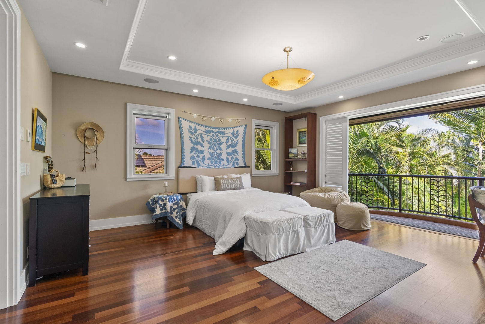 Honolulu Vacation Rentals, Pili Pono - Guest bedroom with a queen-size bed and private balcony access.