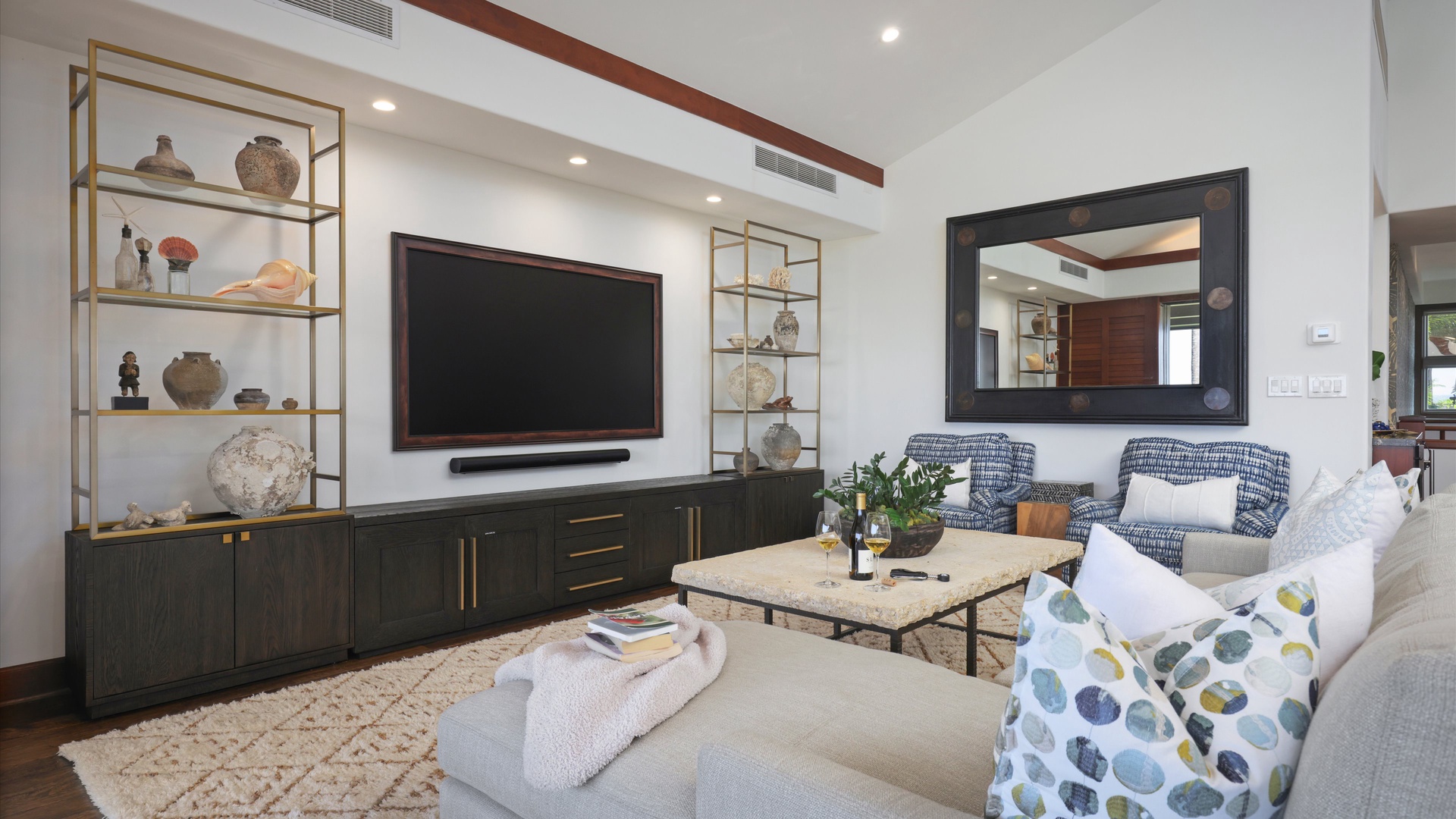 Kailua Kona Vacation Rentals, 3BD Ka'ulu Villa (129B) at Hualalai Resort - Cozy living space with plush seating, large TV, and modern island-inspired design.