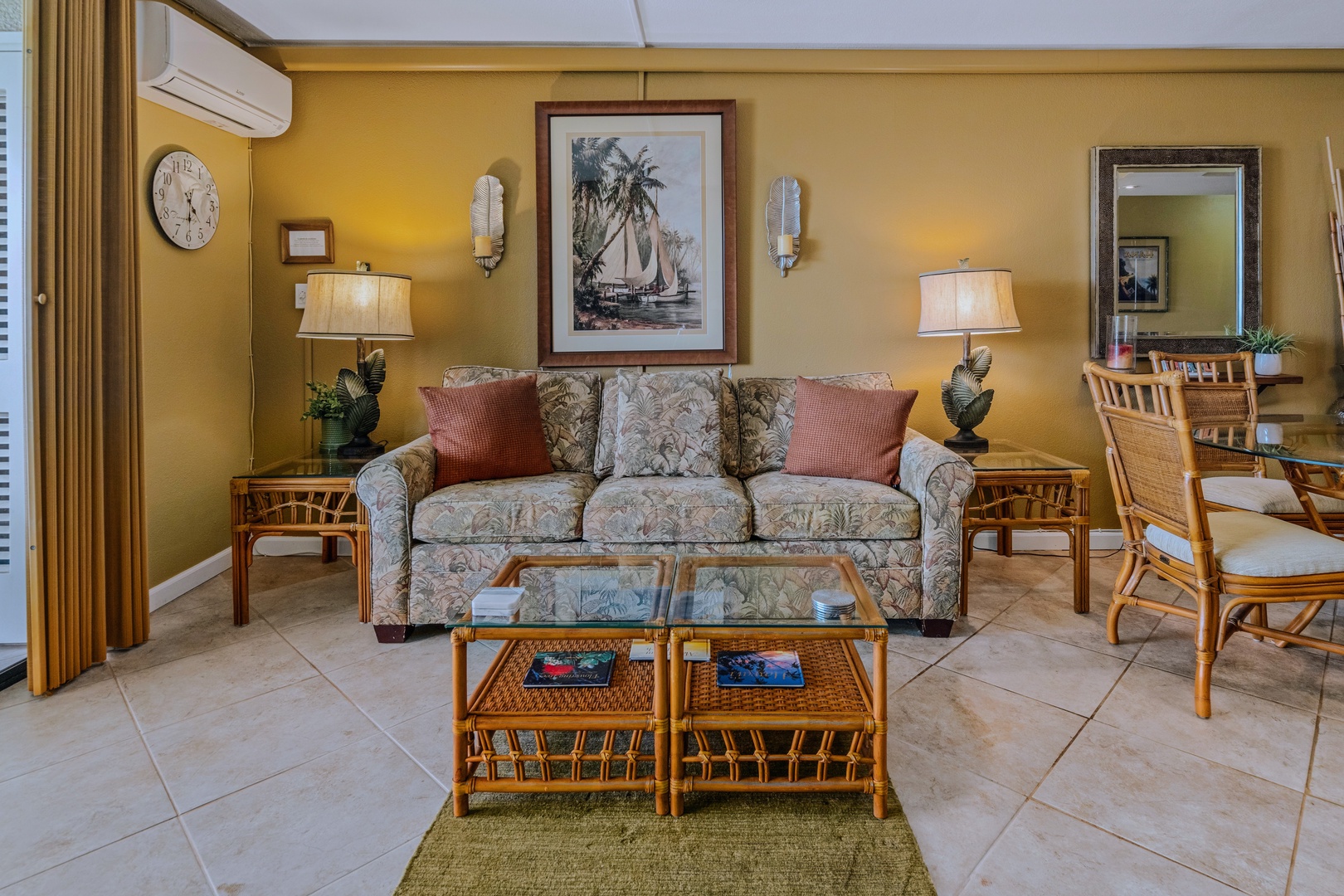 Kihei Vacation Rentals, Kamaole Sands 5310 - Sink into the tropical print sofa, rust-toned pillows adding a pop of color.