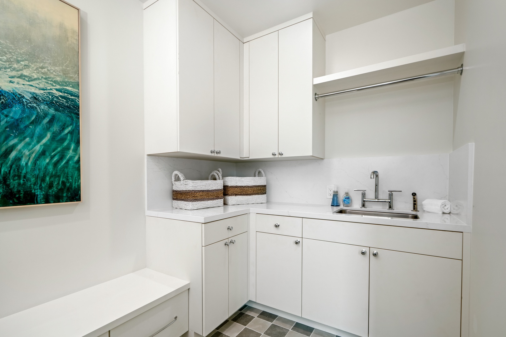 Koloa Vacation Rentals, Hale Laule'a at Kukui'ula - Your dedicated laundry room makes longer stays effortless with crisp white cabinetry, ample storage, and a convenient hanging rod.