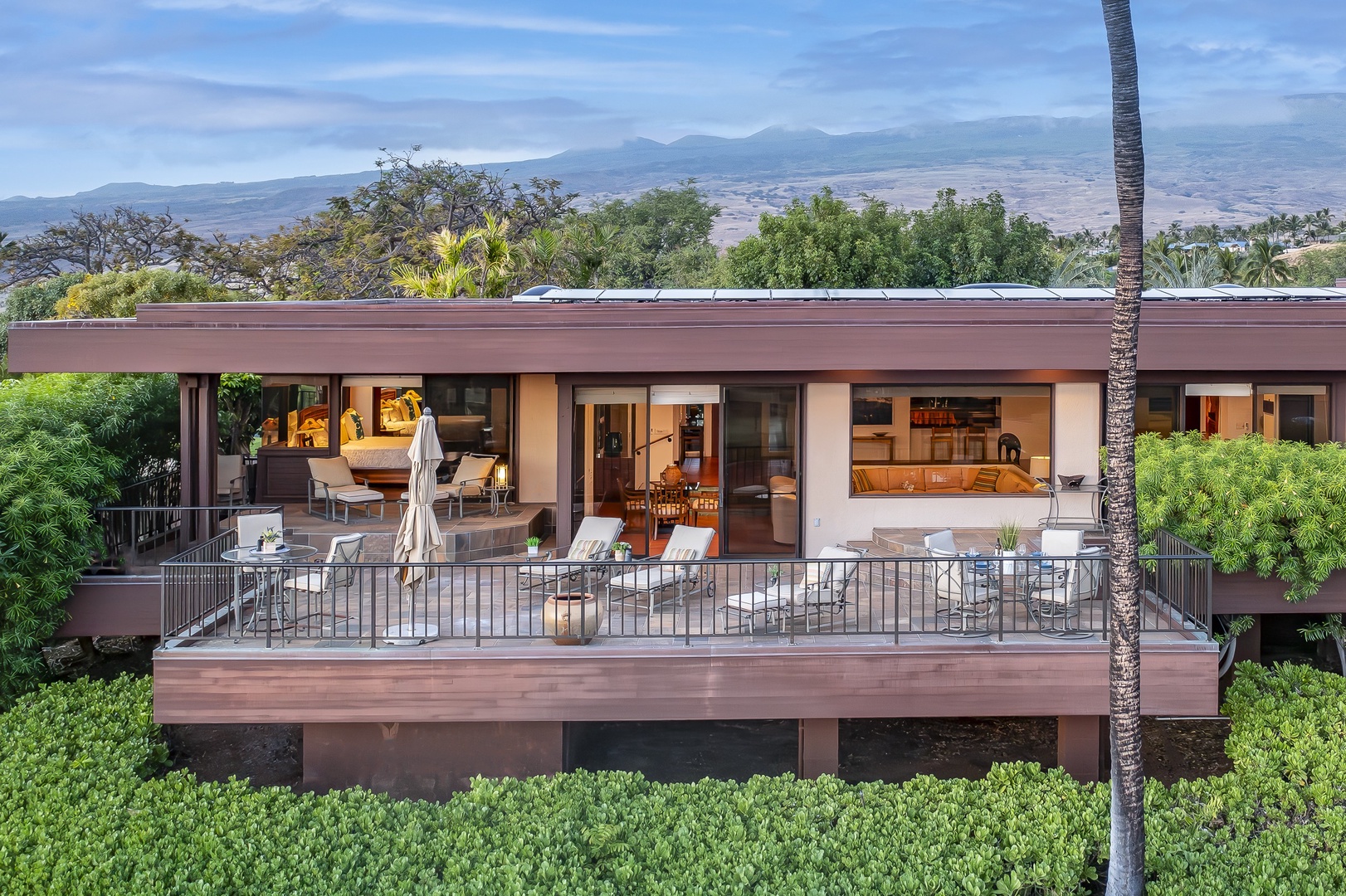 Kamuela Vacation Rentals, Mauna Kea Villas #13 - A rear view of the villa showcases its seamless indoor-outdoor design and architectural elegance.