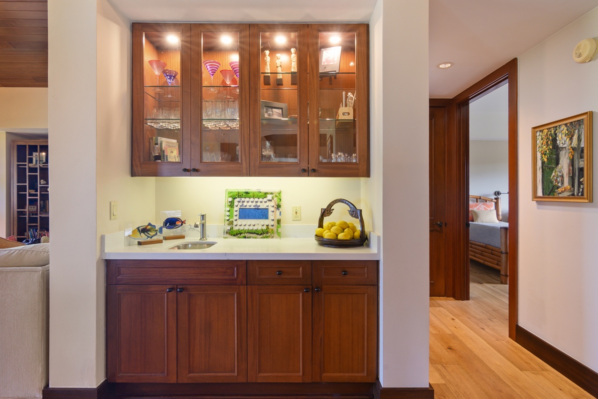 Kailua Kona Vacation Rentals, Fairways Villa 120A - Your elegant kitchenette features warm wood cabinetry, gleaming countertops, and thoughtful lighting—perfect for preparing fresh snacks or morning coffee during your stay.