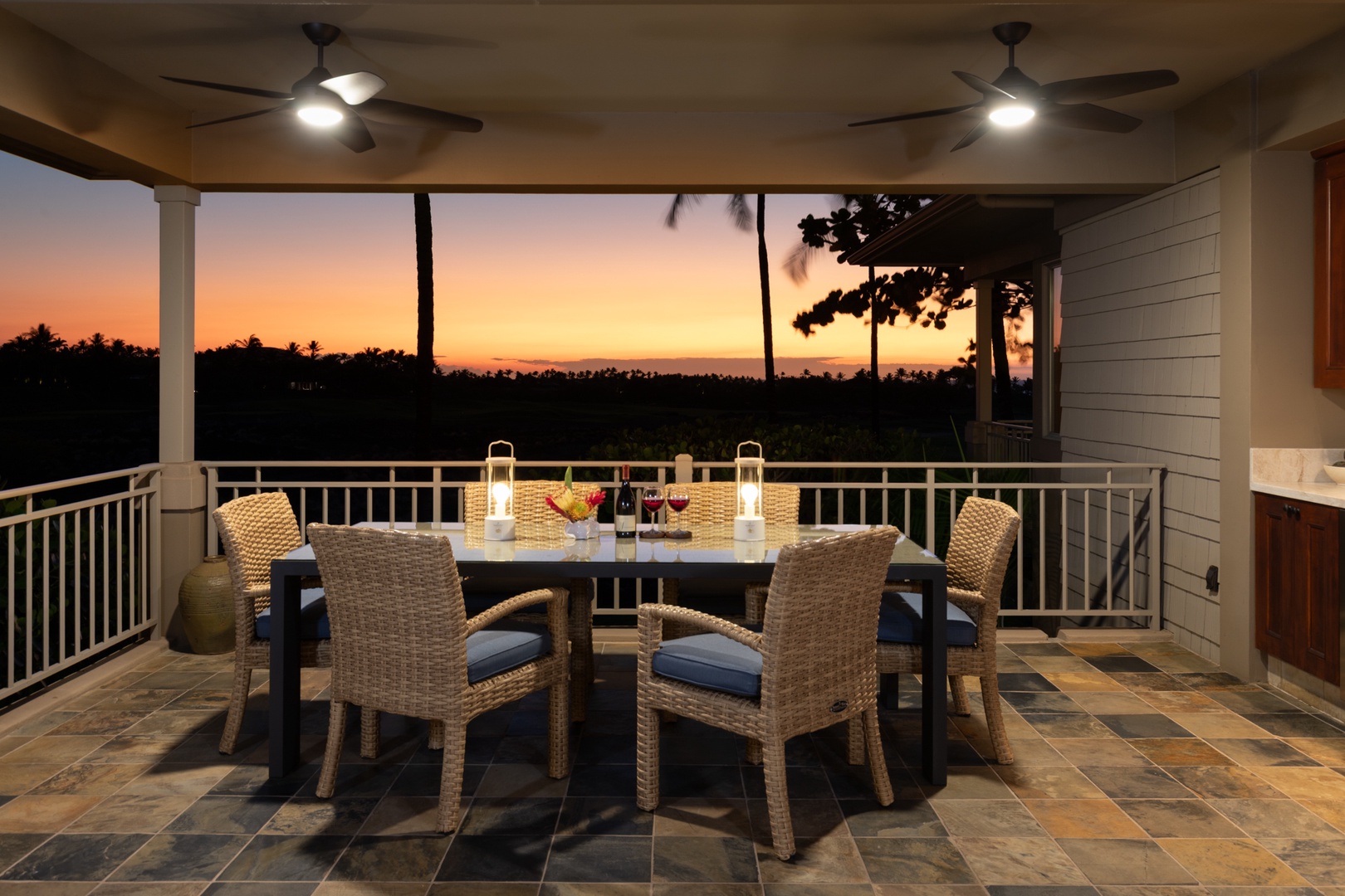 Kailua Kona Vacation Rentals, 3BD Waiulu Villa (111D) at Hualalai Resort - Your private balcony dining awaits with wicker seating and ceiling fans, perfectly positioned for sunset views over tropical landscapes.