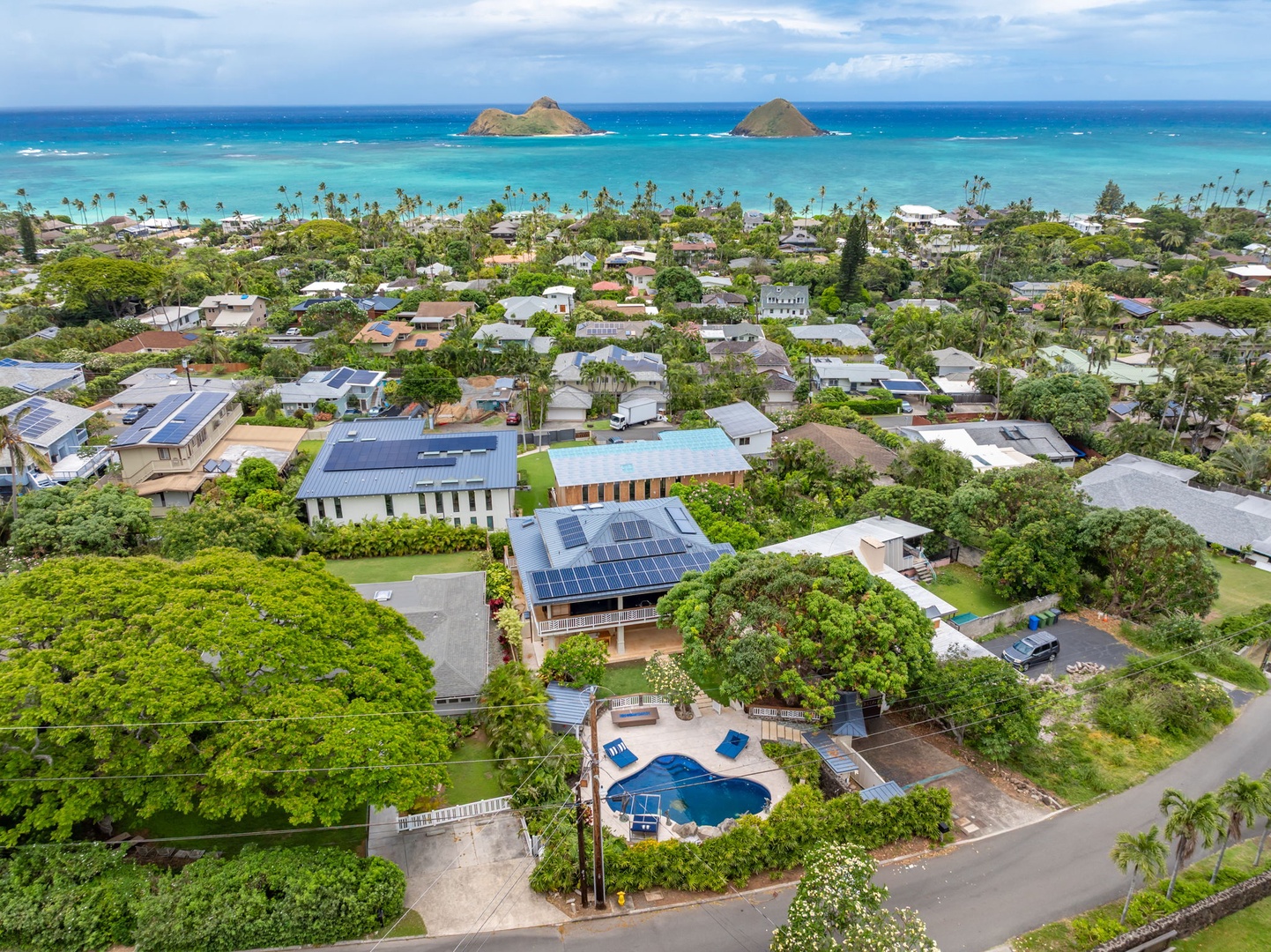 Kailua Vacation Rentals, Leaf House - Aerial view of the coastal neighborhood showcasing the property's proximity to pristine turquoise waters and iconic offshore islands, nestled among lush tropical surroundings.