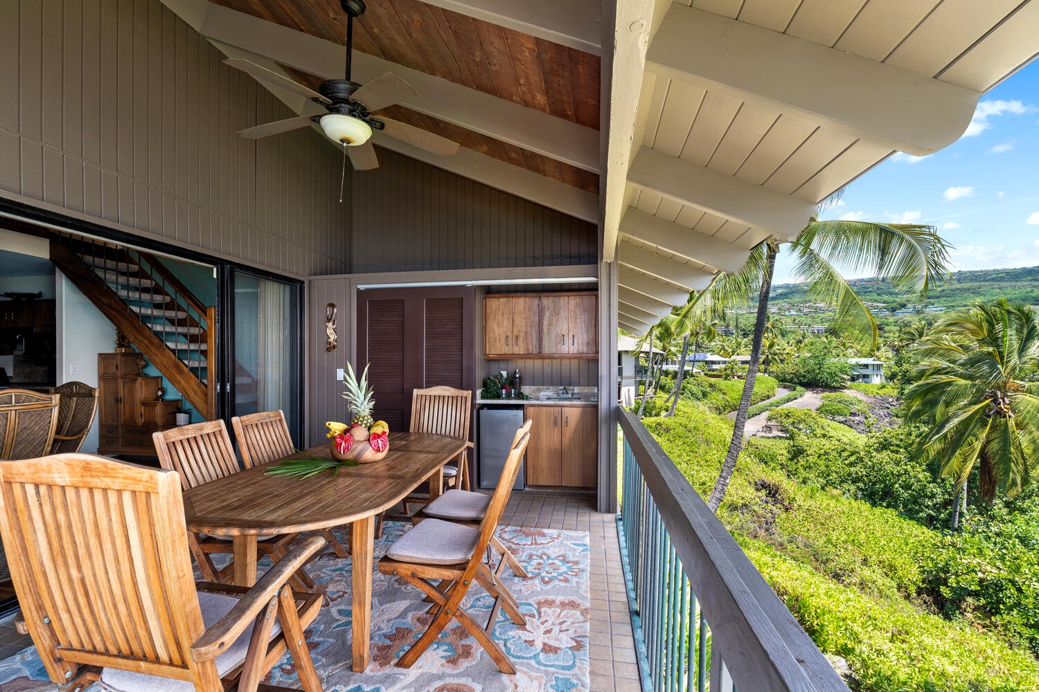 Kailua Kona Vacation Rentals, Kanaloa at Kona 3304 - Relax and dine outdoors with breezy palm-lined views from your lanai.