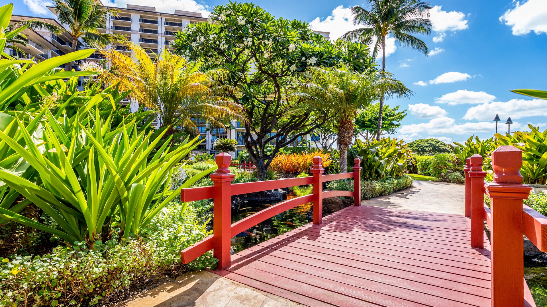 Kapolei Vacation Rentals, Ko Olina Beach Villas B410 - The red bridge crosses over a colorful Koi pond.