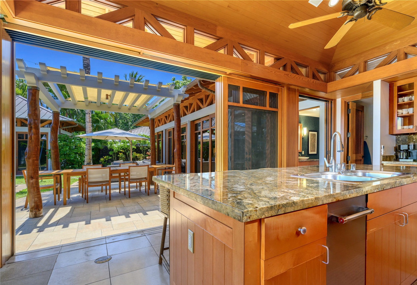 Kamuela Vacation Rentals, 3BD Na Hale 3 at Pauoa Beach Club at Mauna Lani Resort - The island bar overlooking the outdoor lanai with umbrellas for a fun meal prep..