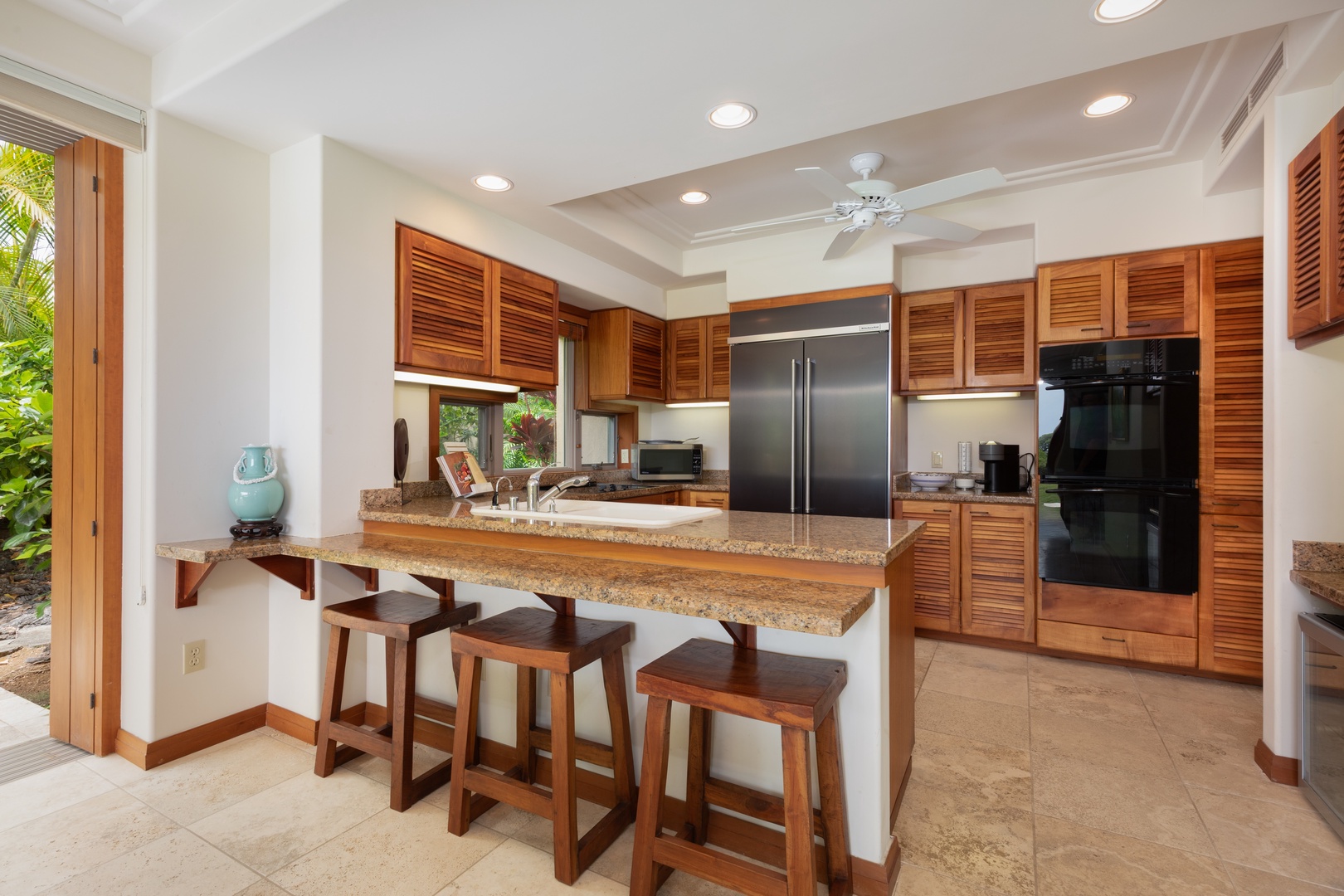 Kailua-Kona Vacation Rentals, 2BD Hillside Villa (6102) at Hualalai Resort - Your fully equipped kitchen features granite counters, stainless appliances, and a breakfast bar perfect for morning coffee.