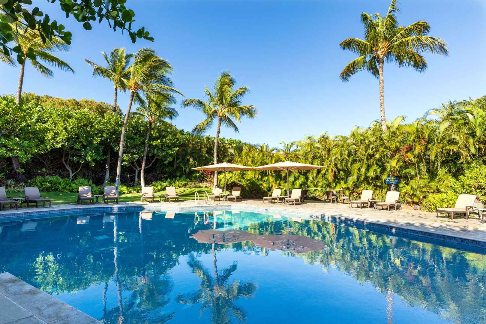 Kamuela Vacation Rentals, Mauna Lani Point E105 - Enjoy the tropical pool just steps away from your unit.