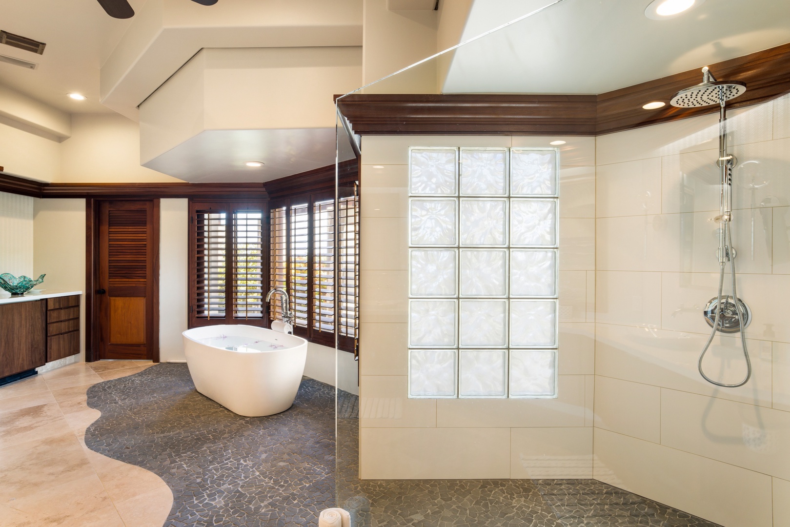 Kamuela Vacation Rentals, Champion Ridge 7 - The spa-like primary bathroom features a walk-in shower and organic textures with elegant privacy.