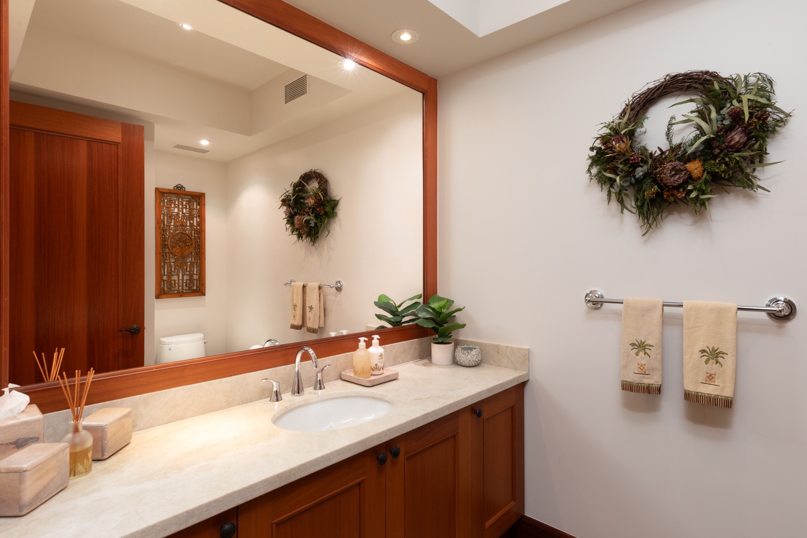 Kailua Kona Vacation Rentals, 3BD Waiulu Villa (111D) at Hualalai Resort - Refresh in your elegant bathroom featuring warm wood vanity, marble countertops, and tropical touches that create a spa-like retreat.