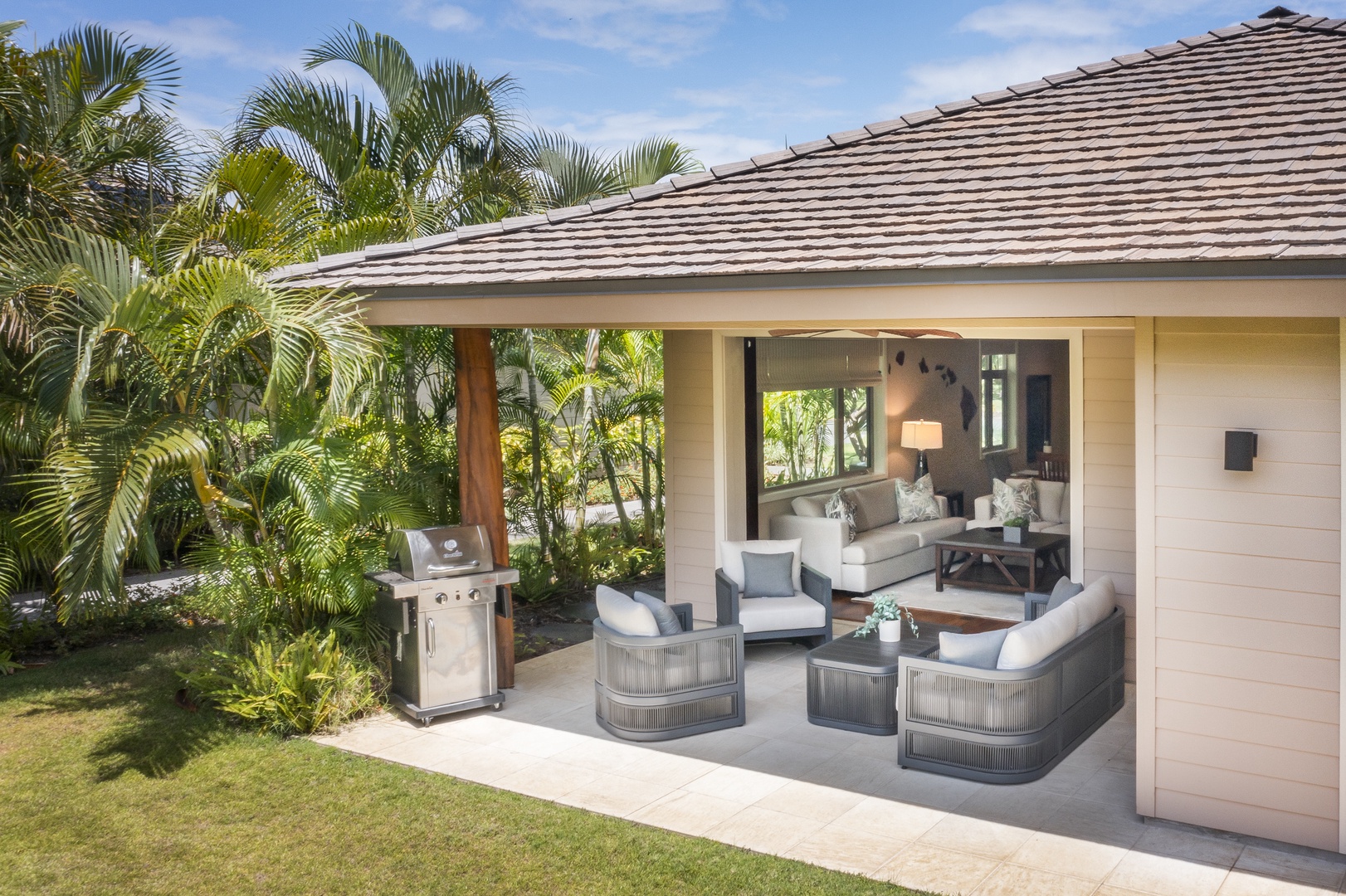 Kamuela Vacation Rentals, Mauna Lani KaMilo #503 - Enjoy seamless indoor-outdoor living with this shaded lanai and private yard—ideal for family gatherings or relaxing after a day at the beach.