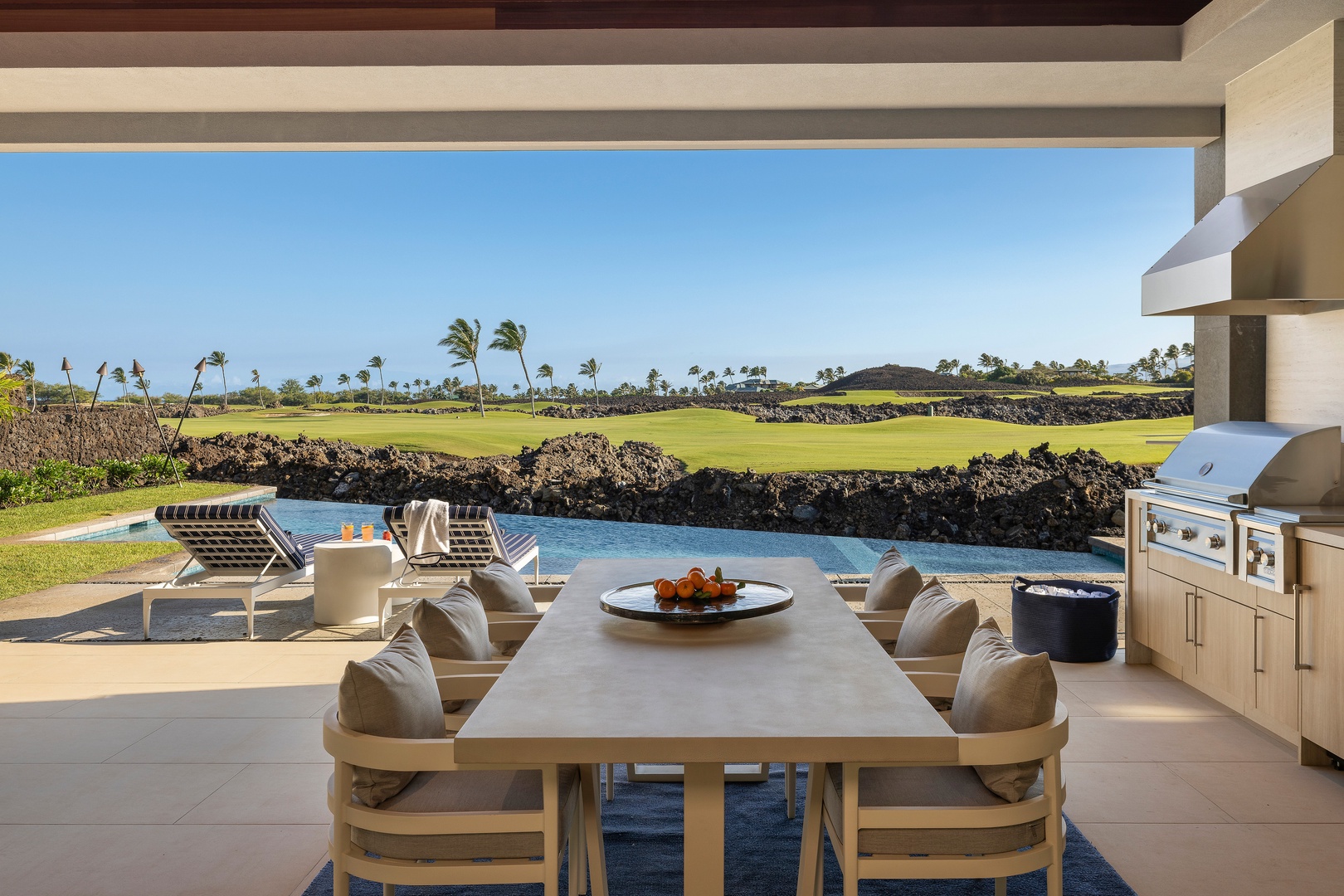 Kamuela Vacation Rentals, 6BD Mauna Lani Lux Golf Estate (6) at One Ocean - Gather, dine, and unwind on this spacious covered lanai overlooking the fairway.