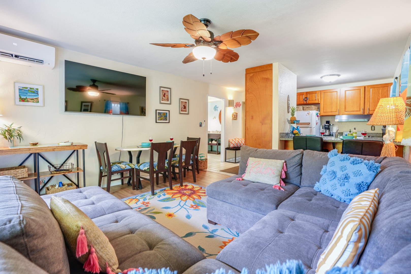 Kapaa Vacation Rentals, Nani Hale - Wind down with movie night in the comfortable living room, featuring central A/C and vibrant island decor.