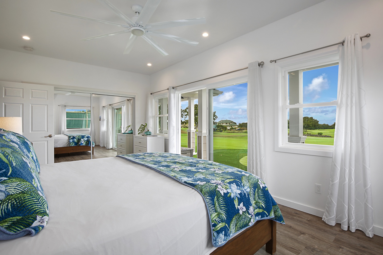 Koloa Vacation Rentals, Haupu Hale at Poipu - Downstairs guest bedroom 2 with vibrant bedding and panoramic views of the golf course.