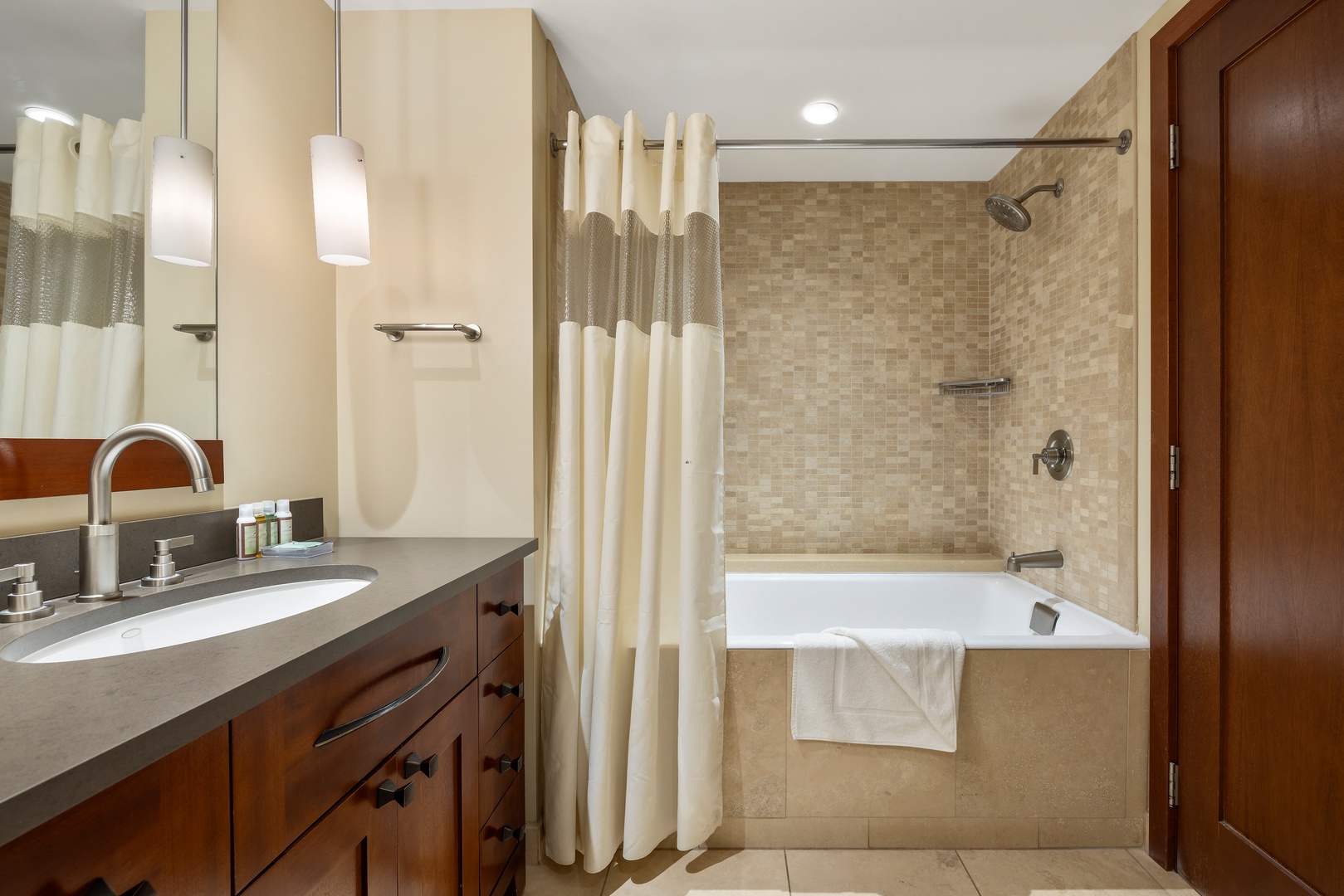 Kapolei Vacation Rentals, Ko Olina Beach Villas B901 - Unwind in your spa-like bathroom with a deep soaking tub, elegant mosaic tiles, and luxurious amenities for ultimate relaxation.