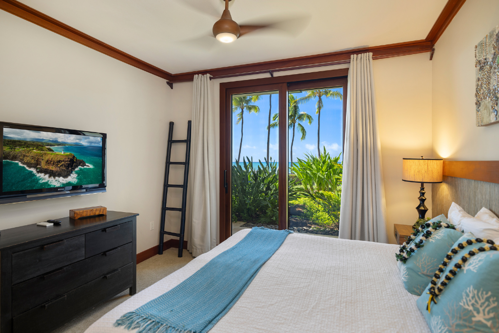 Kapolei Vacation Rentals, Ko Olina Beach Villas B109 - The guest bedroom with private lanai for enjoying sunset and tropical views.