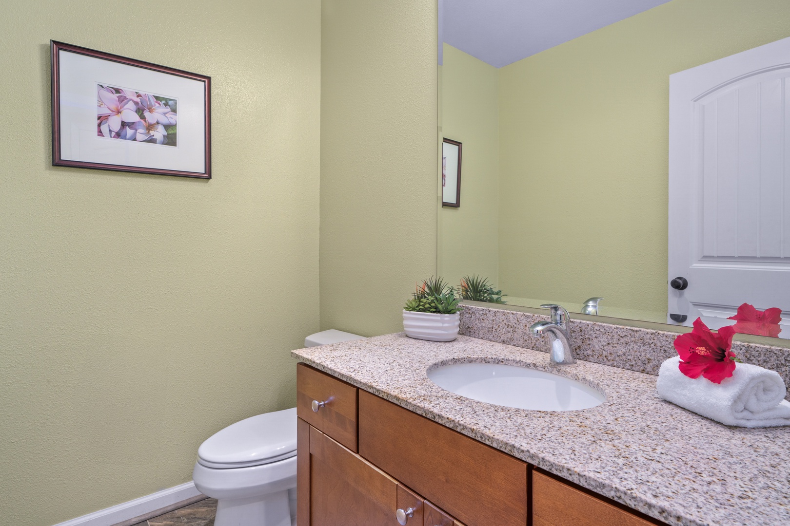 Princeville Vacation Rentals, Kaimana Villa - Your private bathroom features granite countertops, fresh towels, and thoughtful touches like tropical flowers to make you feel at home.