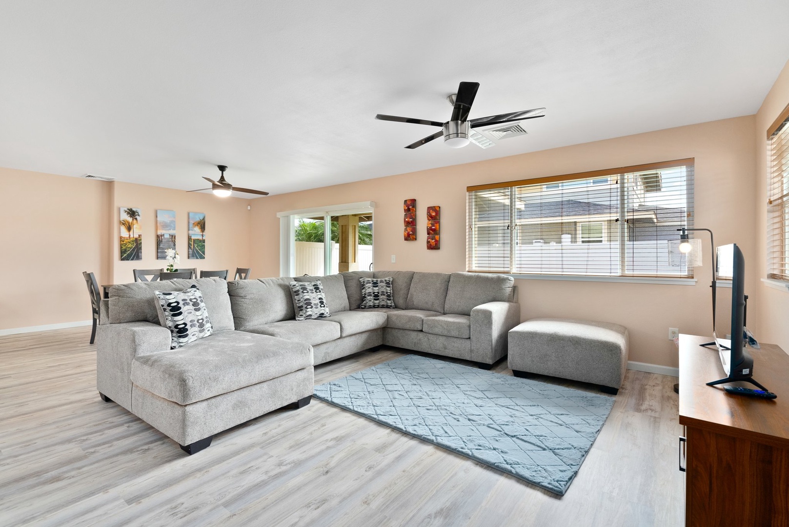 Kapolei Vacation Rentals, Kilipue Retreat - Relax in the bright living room with an oversized sectional and smart TV, perfect for movie nights after a day of exploring.
