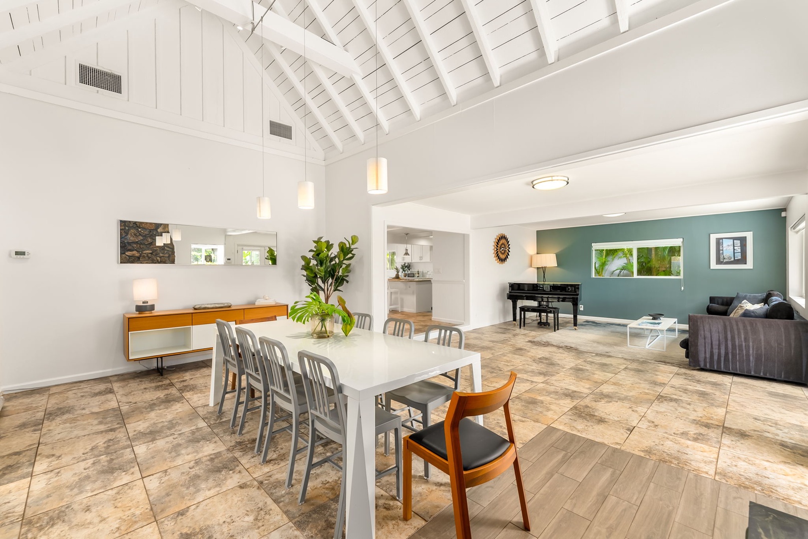 Honolulu Vacation Rentals, Ho'okipa Villa - Picture yourself gathering around this bright, open-plan dining area where vaulted ceilings create an airy, inviting atmosphere perfect for shared meals and conversation.