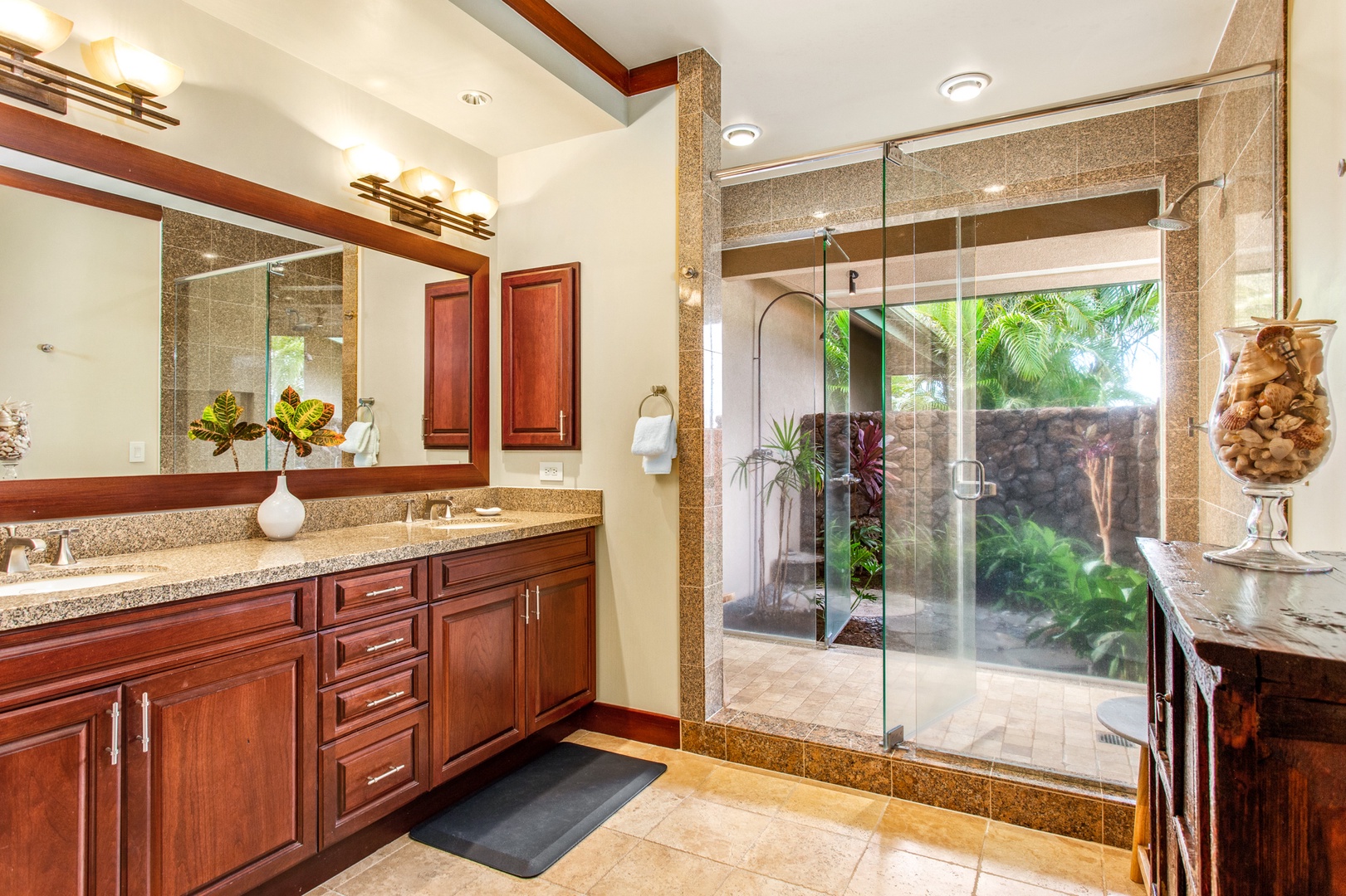 Kamuela Vacation Rentals, 3BD Wai'ula'ula Villa (312) at Mauna Kea Resort - Spa-inspired bathroom with dual vanities, glass-enclosed shower, and premium finishes for a touch of luxury.