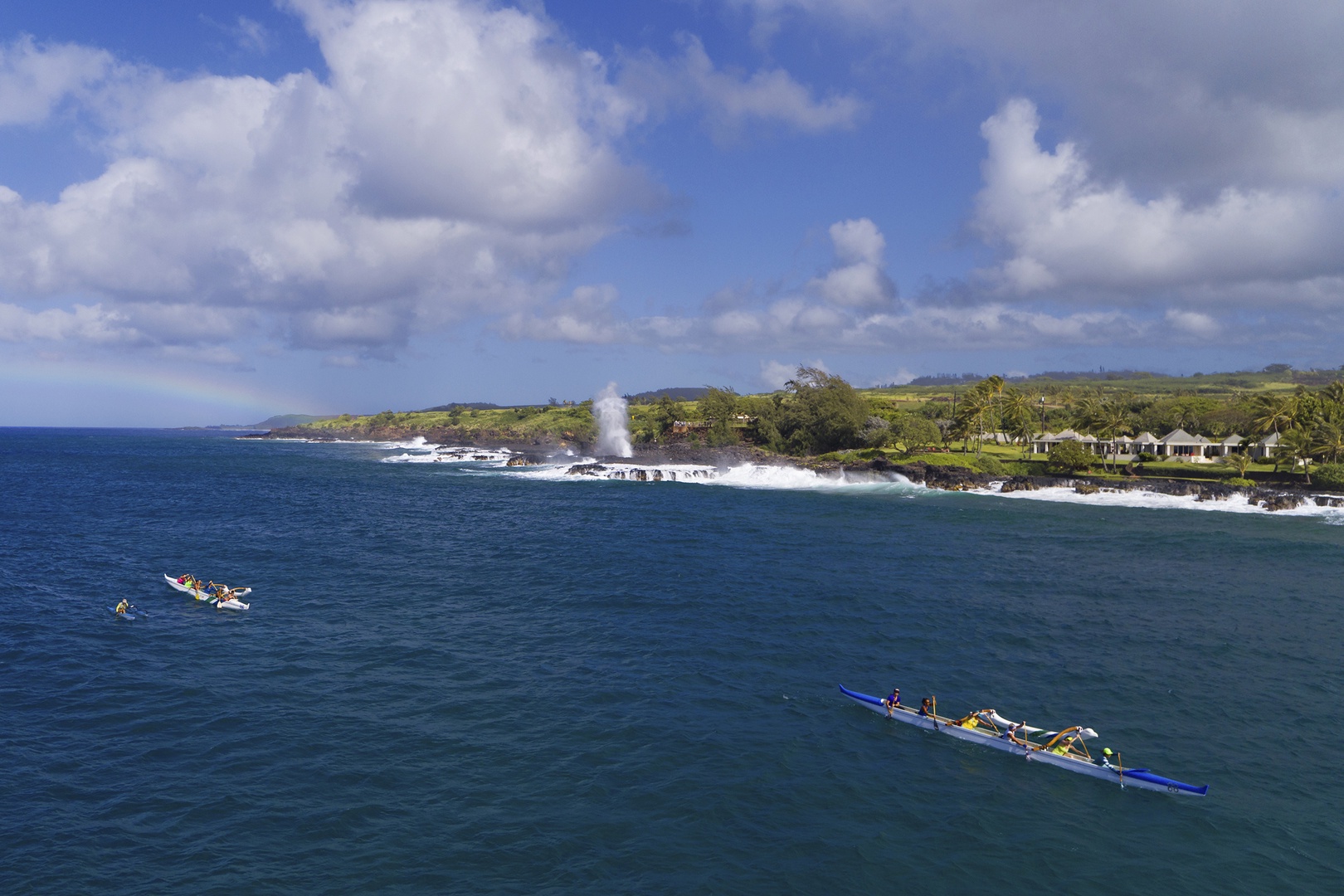 Koloa Vacation Rentals, Ke Kai Nui at Kukuiula - Experience the power of nature at Spouting Horn blowhole while outrigger canoes glide gracefully nearby.