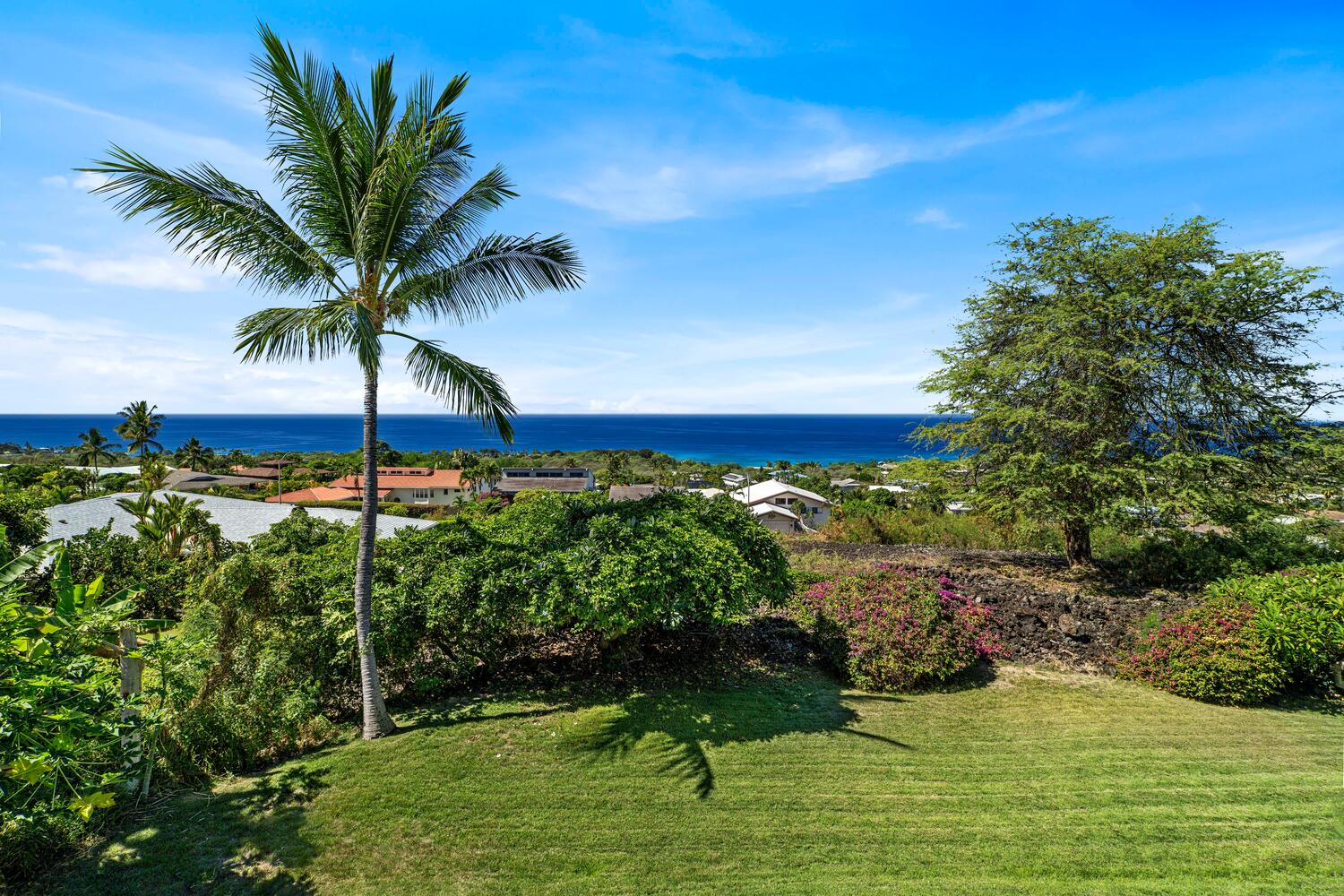 Kailua Kona Vacation Rentals, Ho'okipa Hale - Lush green landscaping and coastal views make this backyard a true Hawaiian oasis.
