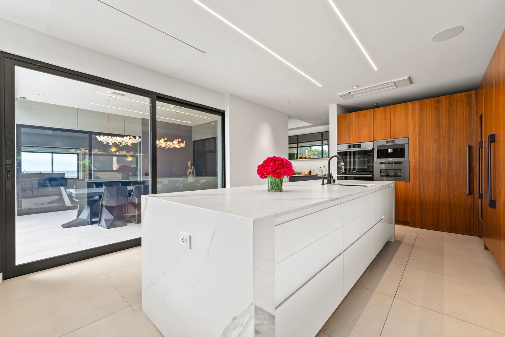 Honolulu Vacation Rentals, Ocean Villa Emilie - From sunrise breakfasts to sunset bites, this designer kitchen flows seamlessly into the outdoors.