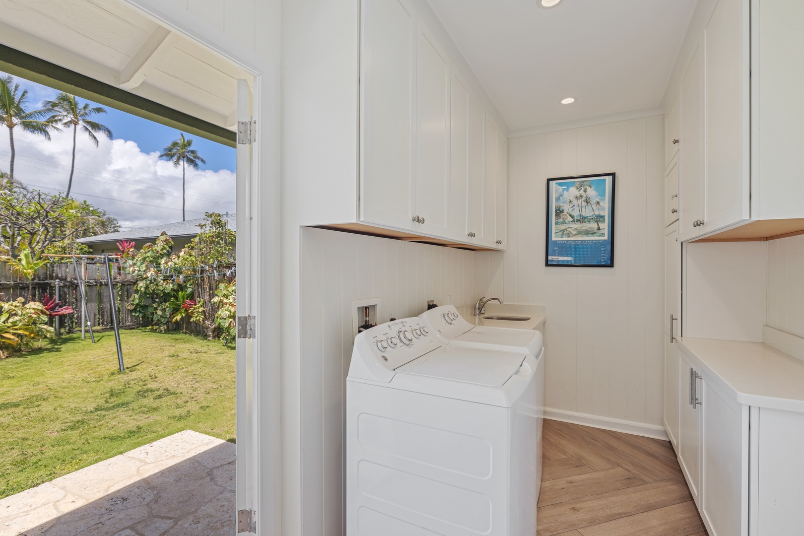 Kailua Vacation Rentals, Hale Moana Lanikai - This practical laundry area is efficiently designed with a top-loading washer, providing all the necessary amenities for home care